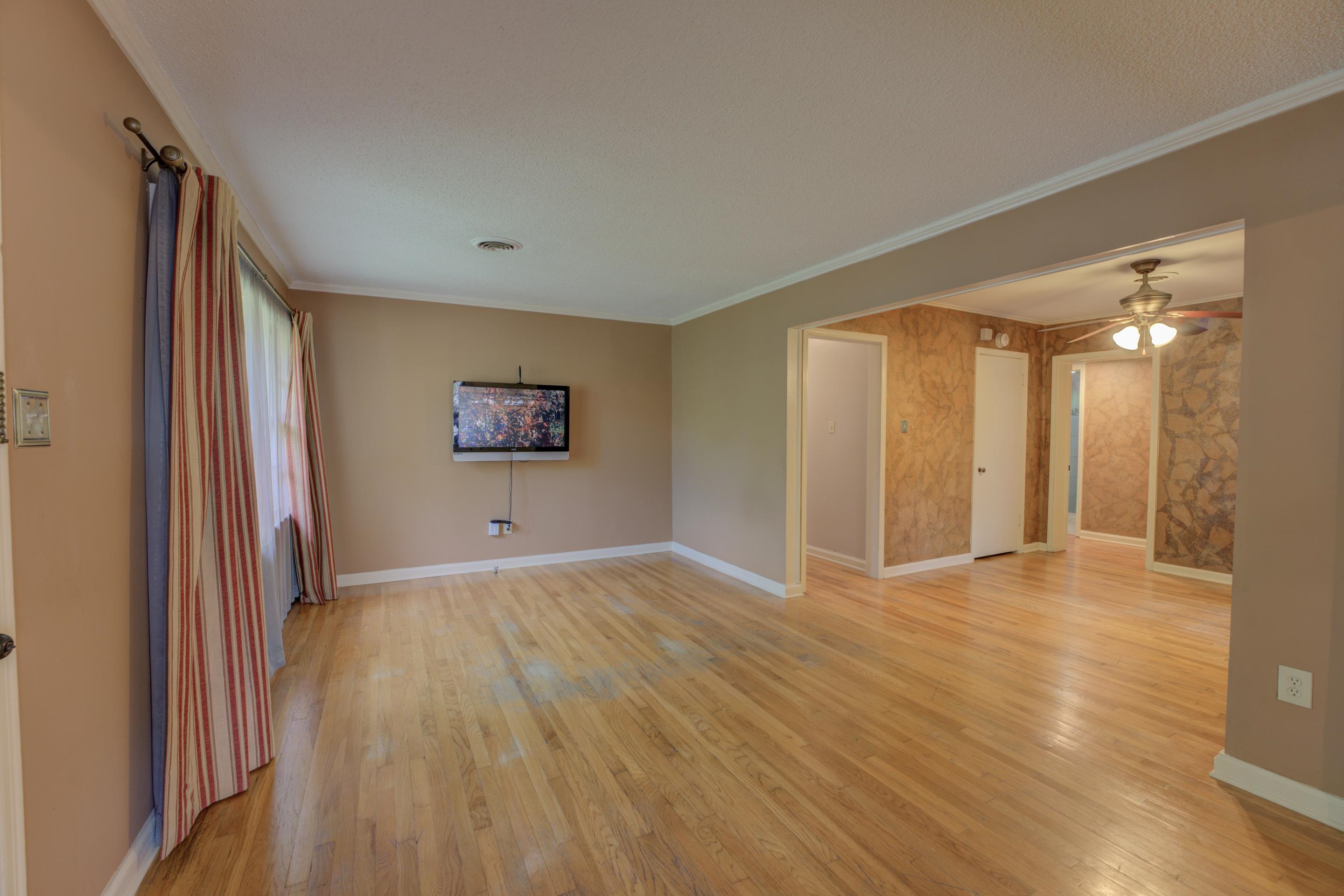 1155 Marcia Road Memphis, TN 38117 - Photo 4 of 31 a view of a big room with wooden floor and windows