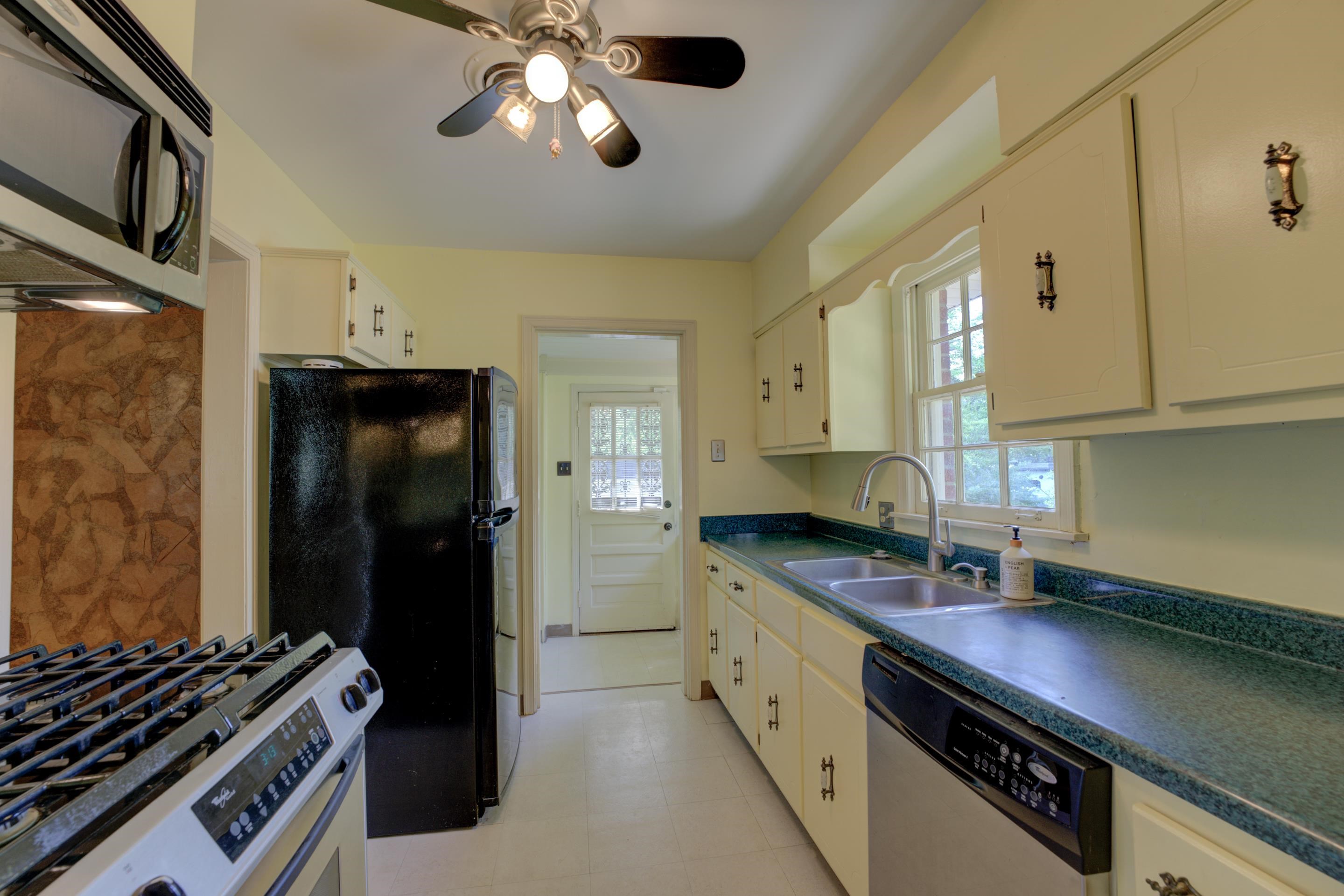 1155 Marcia Road Memphis, TN 38117 - Photo 8 of 31 a kitchen with stainless steel appliances a sink a stove and a refrigerator
