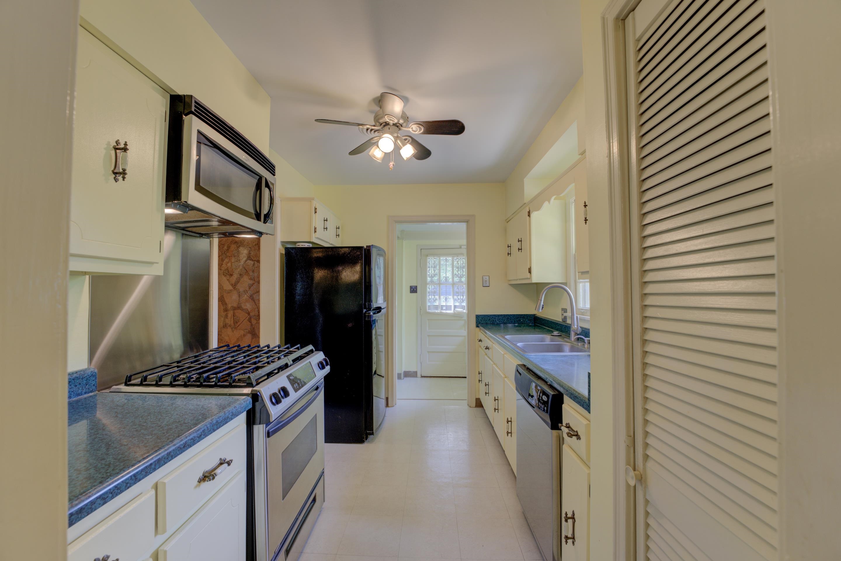 1155 Marcia Road Memphis, TN 38117 - Photo 9 of 31 a kitchen with stainless steel appliances a sink stove and refrigerator