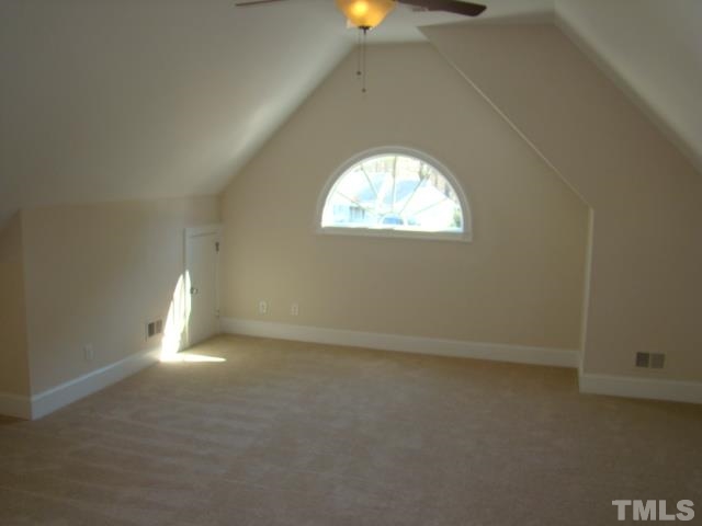 3517 Blue Ridge Road Raleigh, NC 27612 - Photo 12 of 16 an empty room with wooden floor and windows