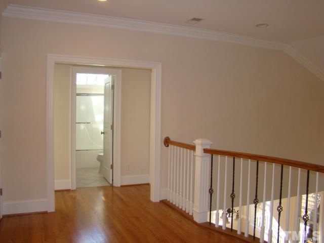 3517 Blue Ridge Road Raleigh, NC 27612 - Photo 14 of 16 a view of a hallway with wooden floor
