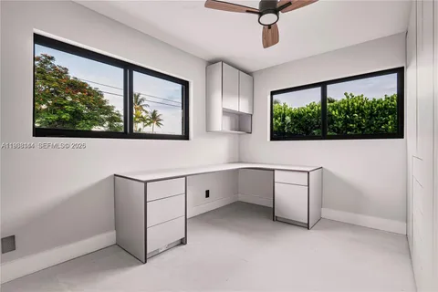 a view of workspace with furniture and window