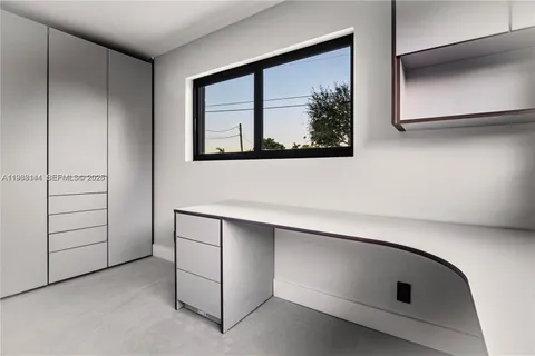 a view of a livingroom with furniture and a potted plant