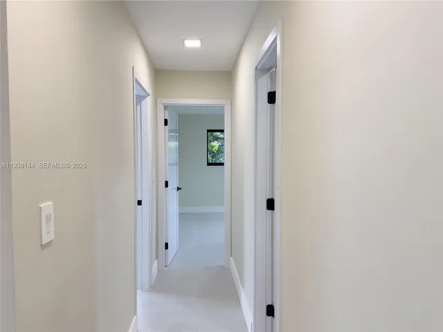 a bathroom with a sink a shower and a mirror