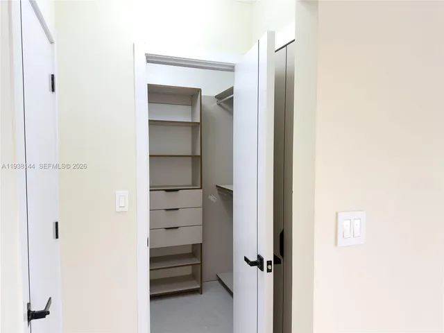 a view of room with rack on the wall