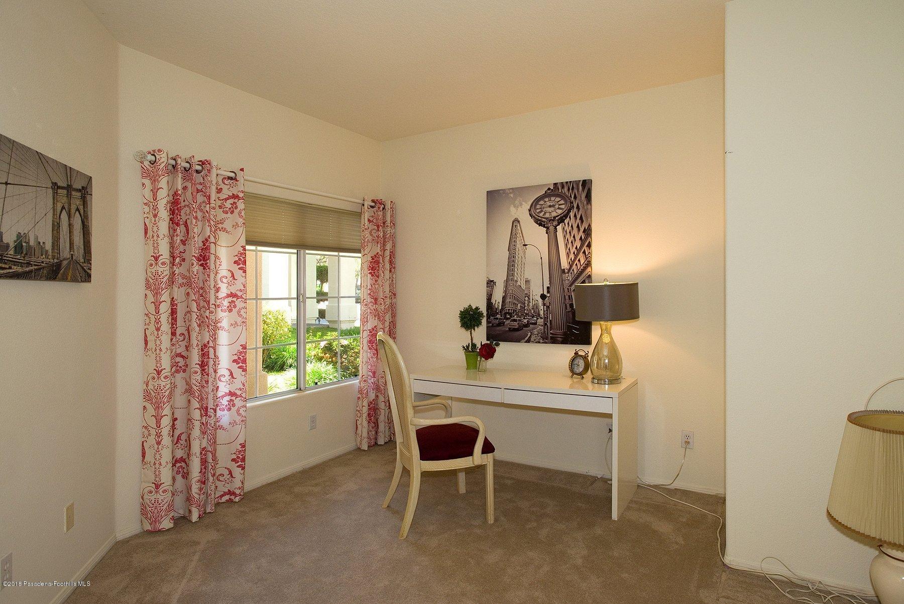 925 C. Amable Glendale, CA 91208 - Photo 17 of 37 a room with a window and a table in it