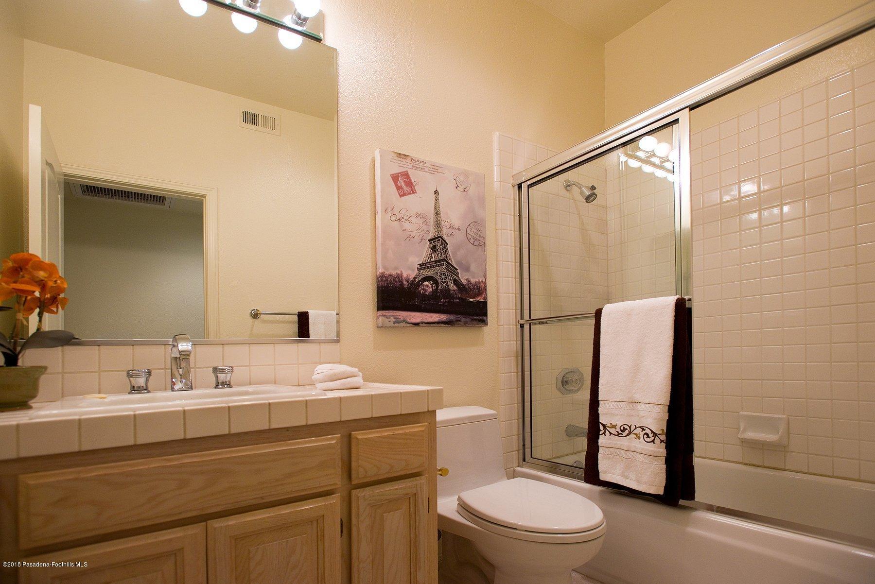 925 C. Amable Glendale, CA 91208 - Photo 18 of 37 a bathroom with a sink a toilet and shower