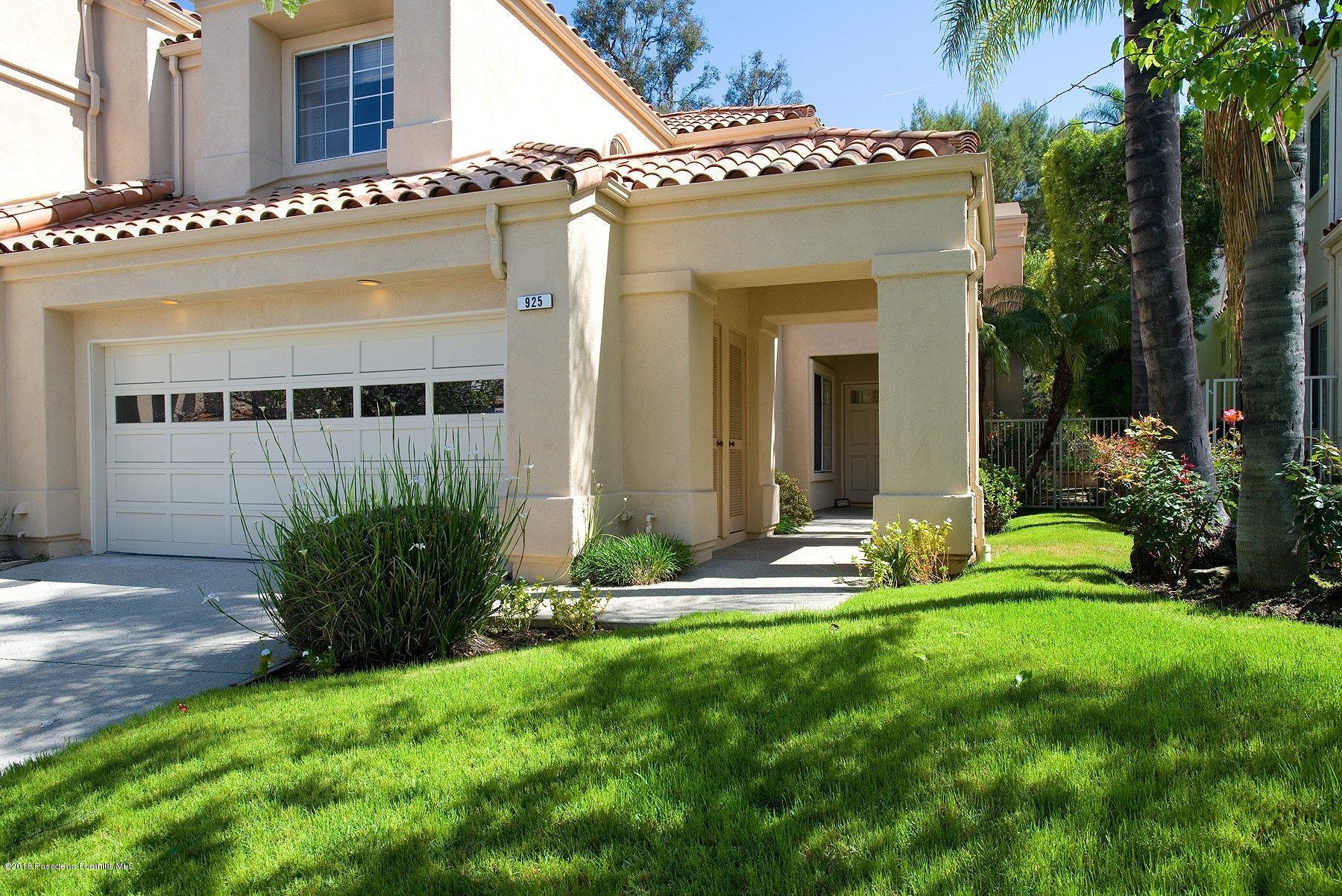 925 C. Amable Glendale, CA 91208 - Photo 2 of 37 a view of a house with brick walls and a yard with plants