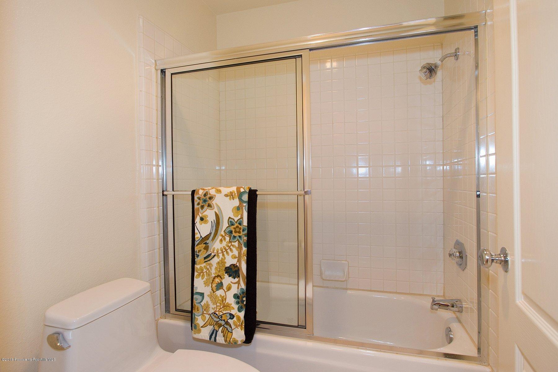 925 C. Amable Glendale, CA 91208 - Photo 21 of 37 a bathroom with a shower and a toilet