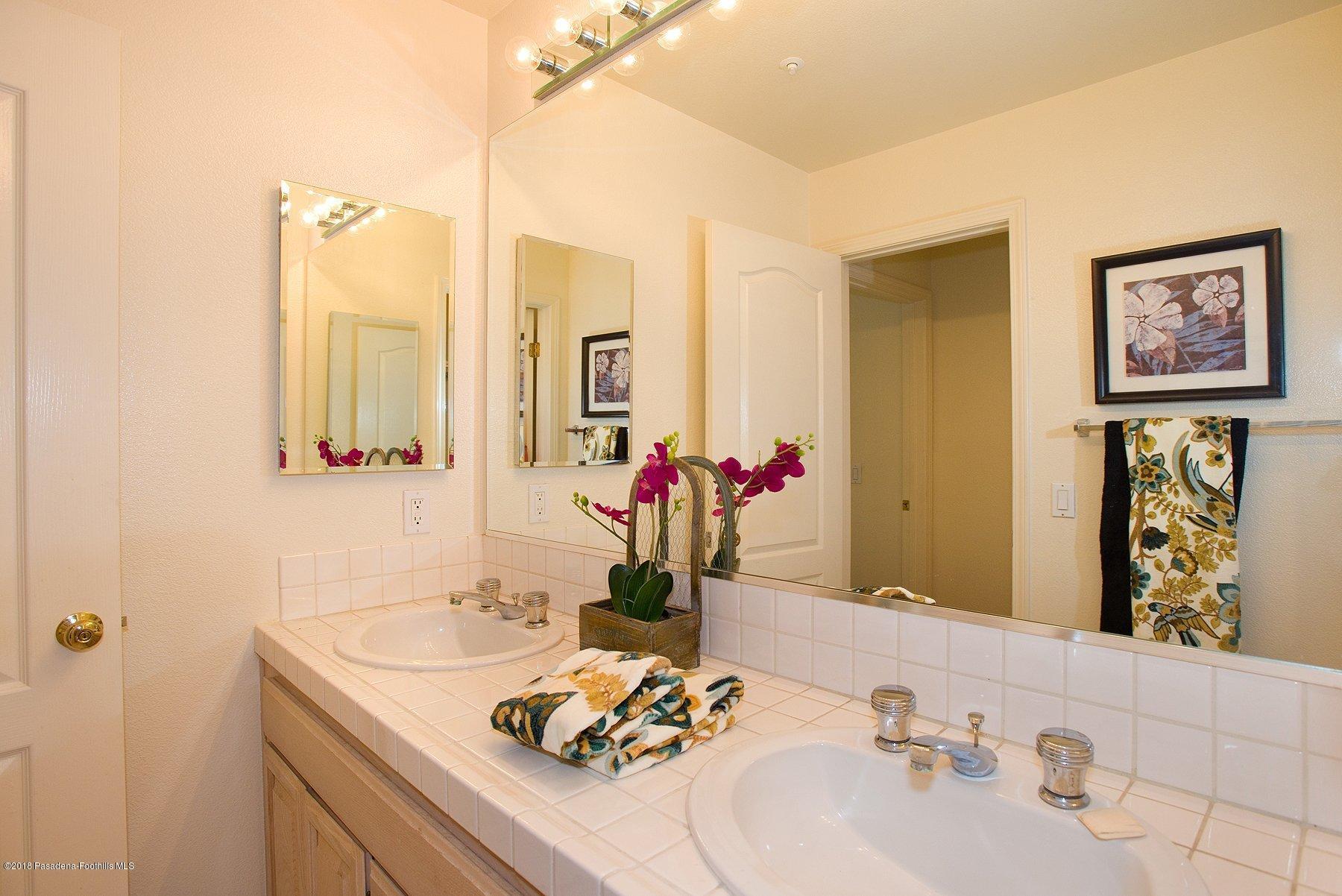 925 C. Amable Glendale, CA 91208 - Photo 22 of 37 a bathroom with a sink and a mirror
