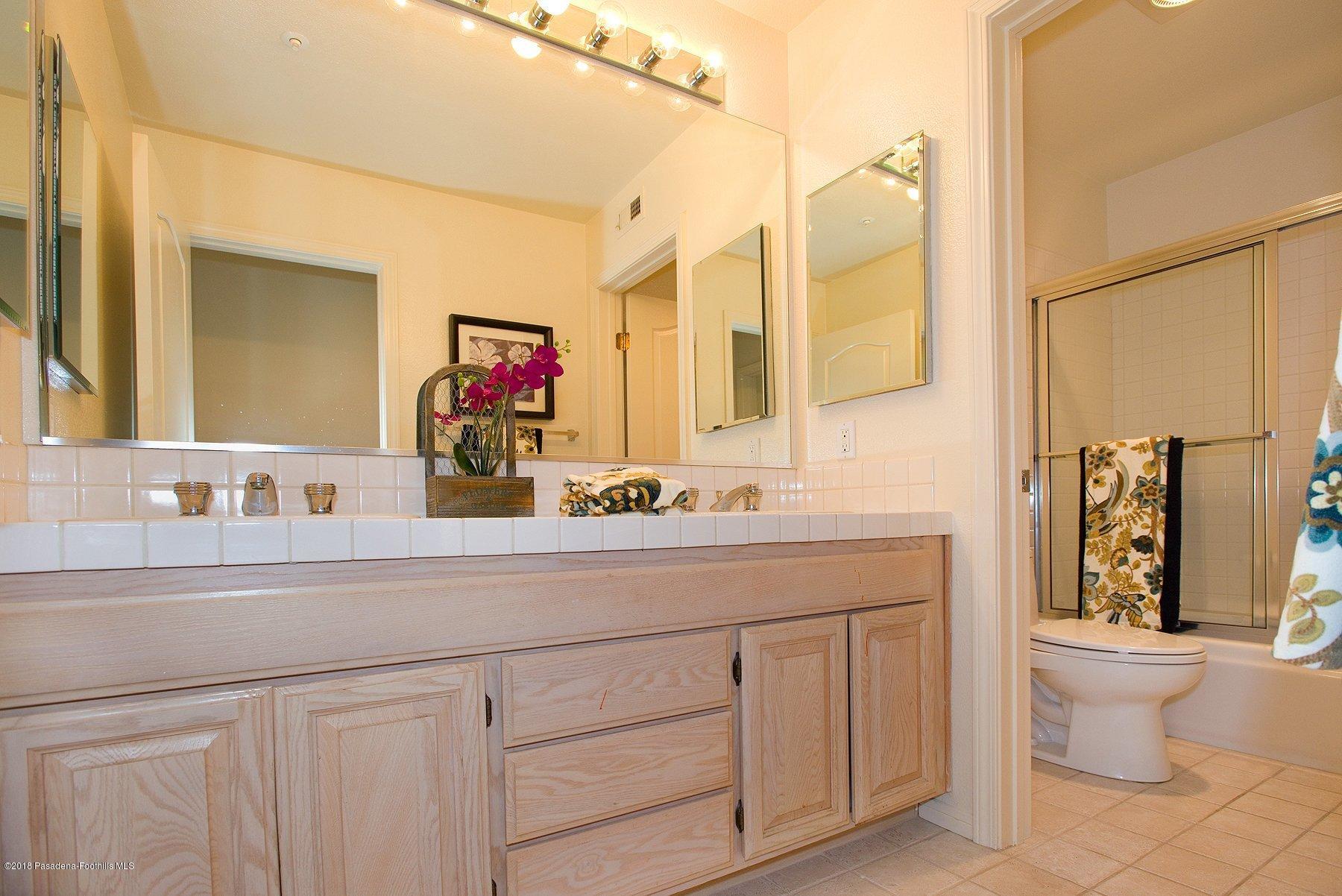 925 C. Amable Glendale, CA 91208 - Photo 23 of 37 a bathroom with a toilet sink and mirror