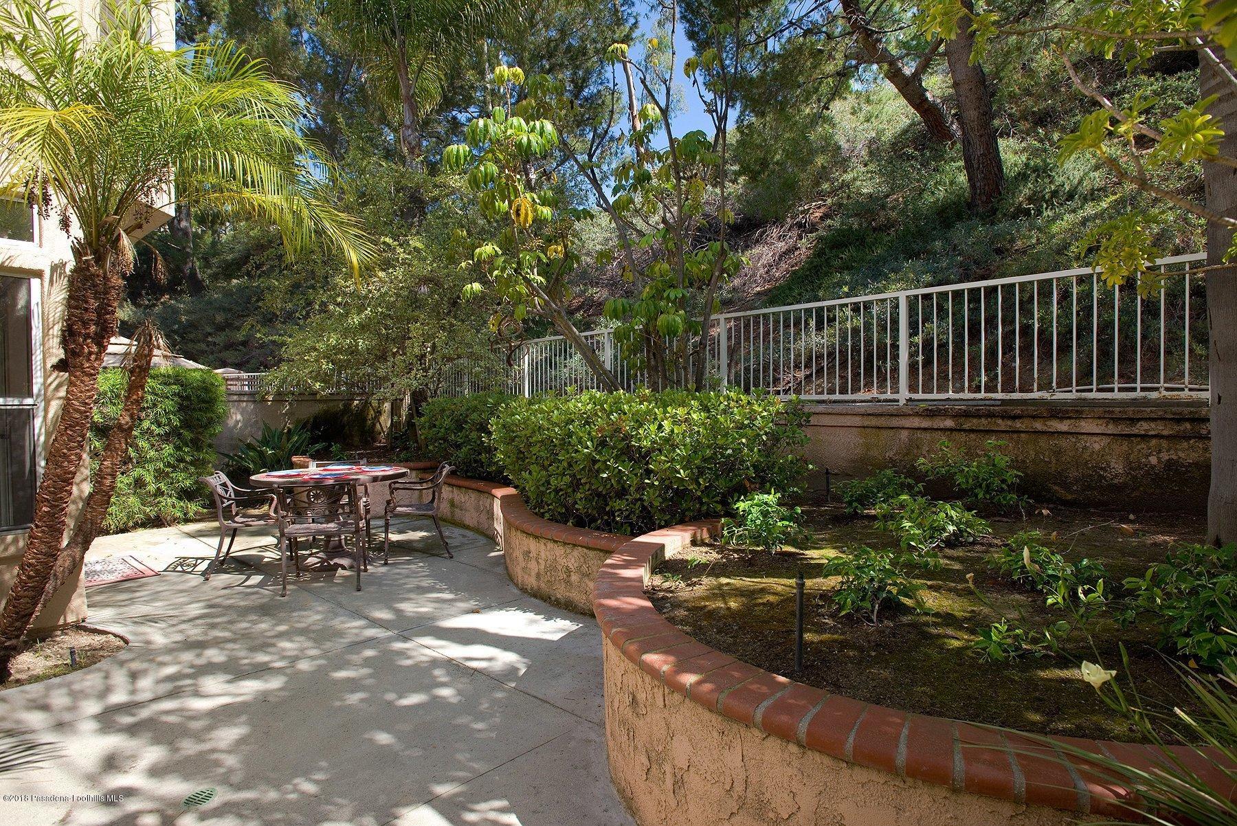 925 C. Amable Glendale, CA 91208 - Photo 35 of 37 a view of a chair and tables in the backyard