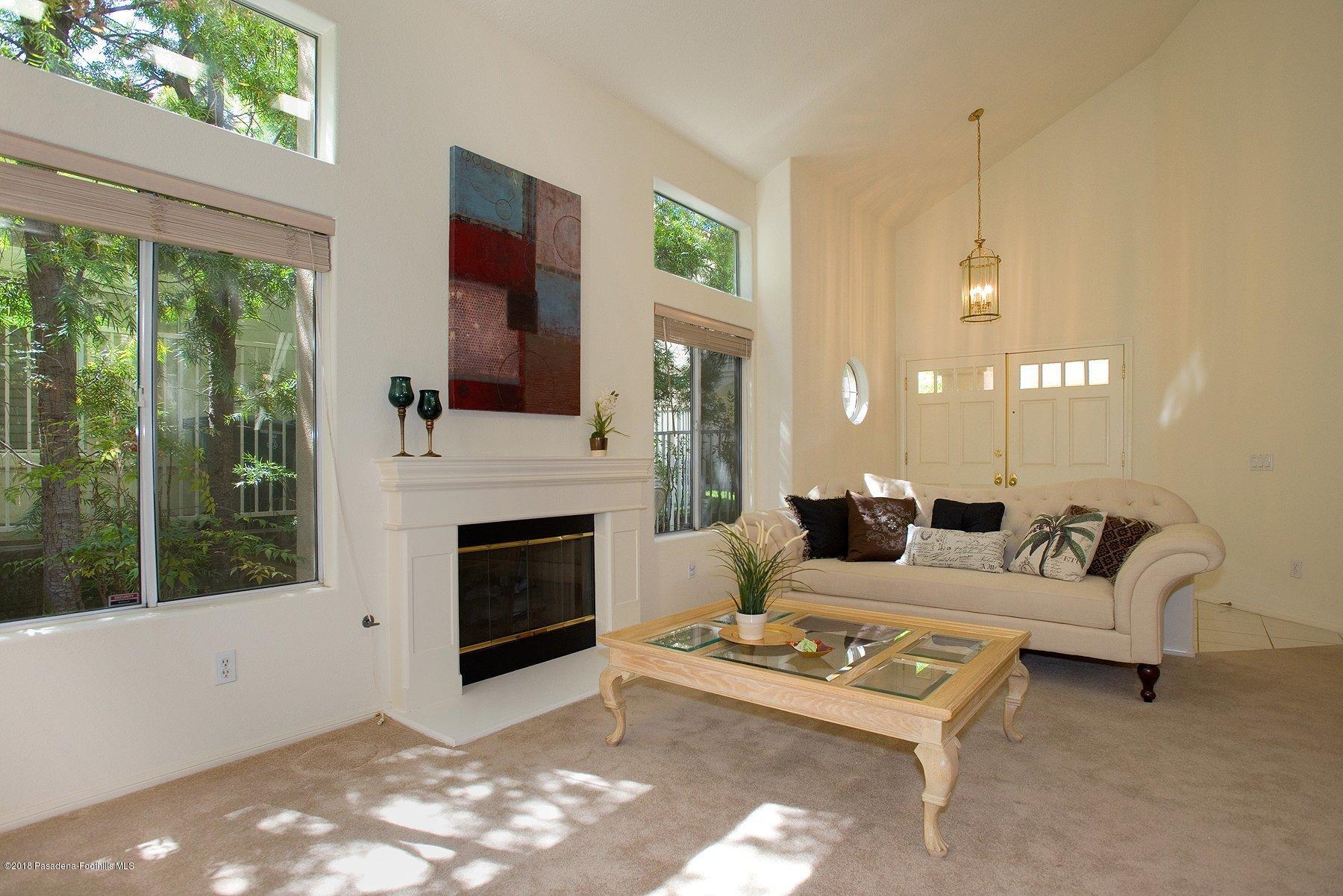 925 C. Amable Glendale, CA 91208 - Photo 5 of 37 a living room with furniture and a fireplace