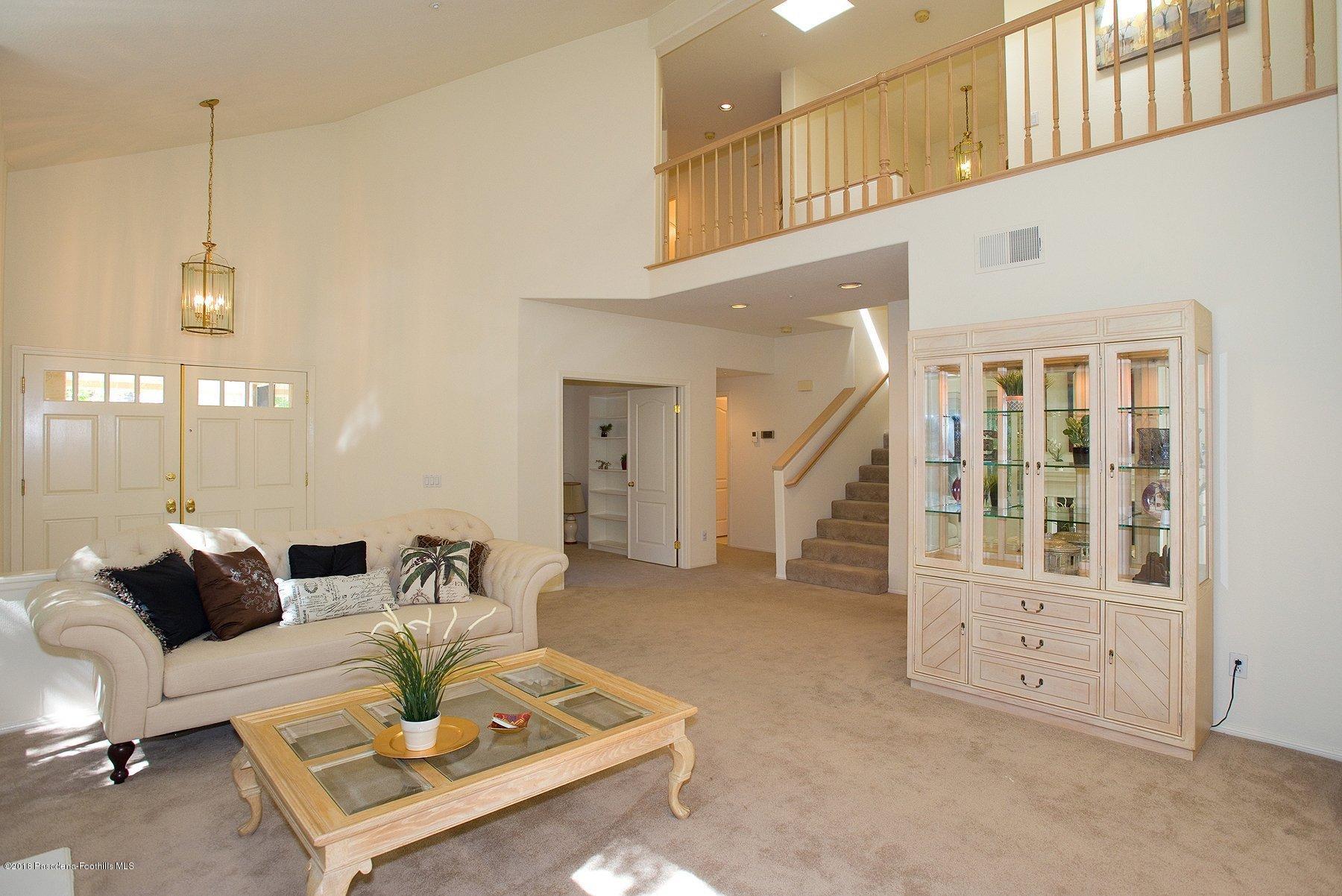 925 C. Amable Glendale, CA 91208 - Photo 6 of 37 a living room with furniture and a table