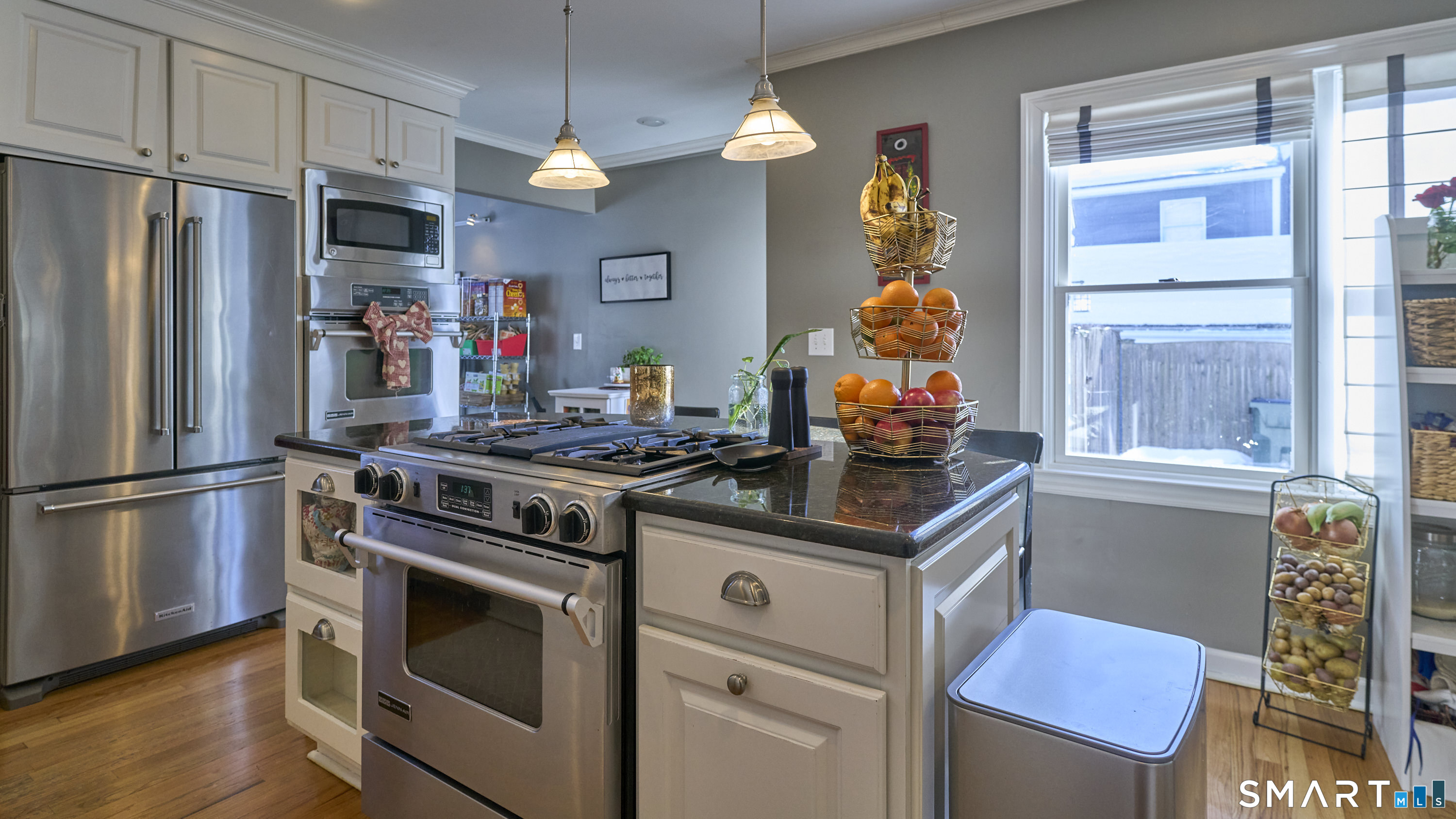 342 South Main Street West Hartford, CT 06107 - Photo 11 of 36 a kitchen with stainless steel appliances granite countertop a stove and a refrigerator