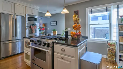 a kitchen with lots of counter top space and cabinets