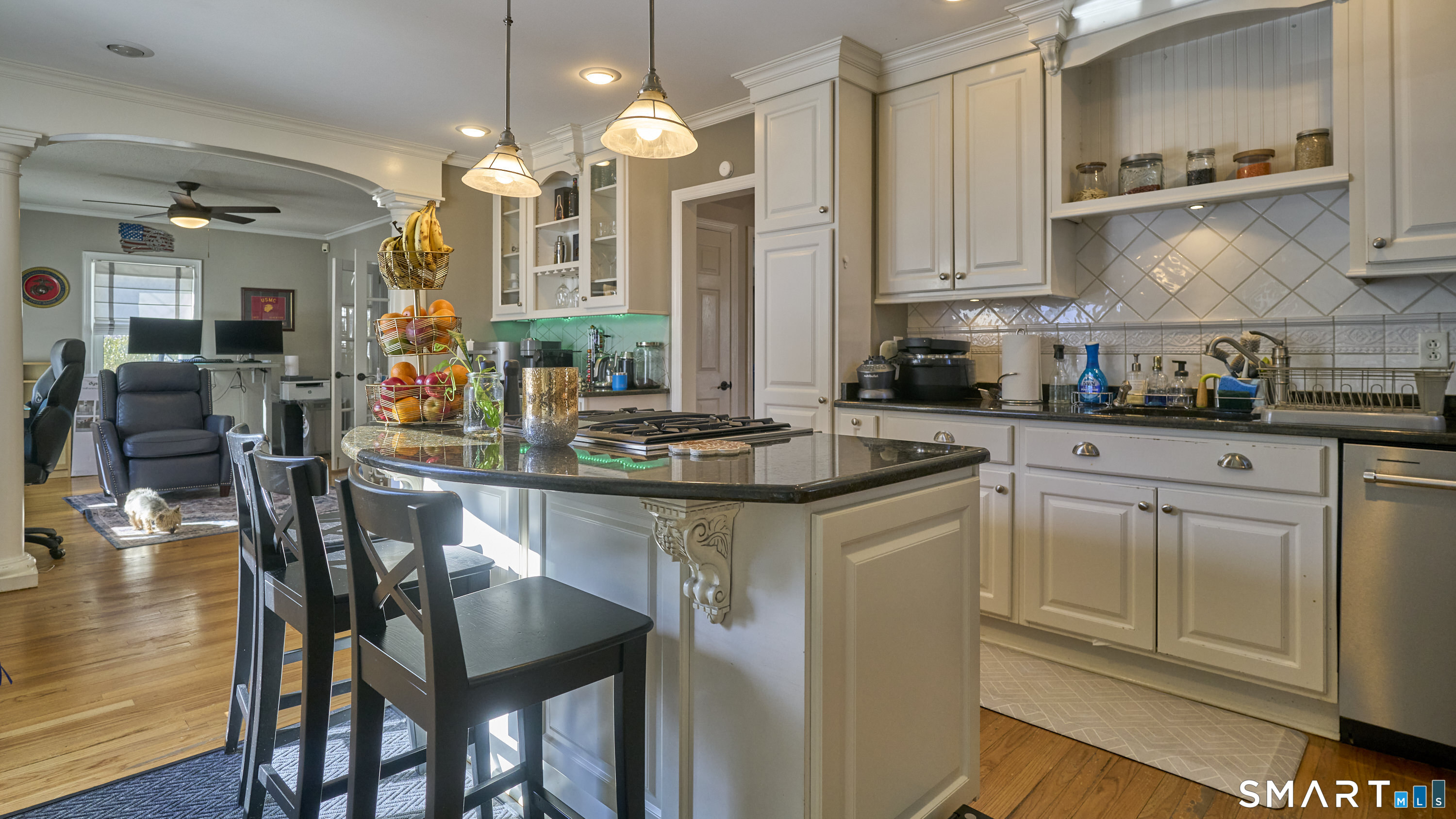 342 South Main Street West Hartford, CT 06107 - Photo 12 of 36 a kitchen with stainless steel appliances kitchen island granite countertop a table chairs sink and cabinets