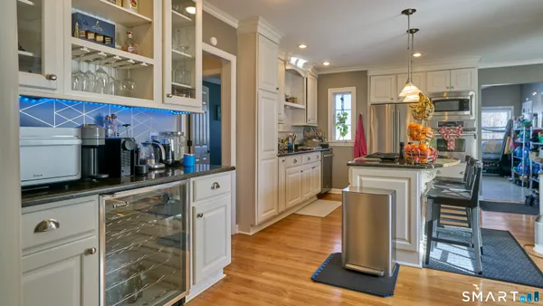 a kitchen view with stainless steel appliances a refrigerator and cabinets
