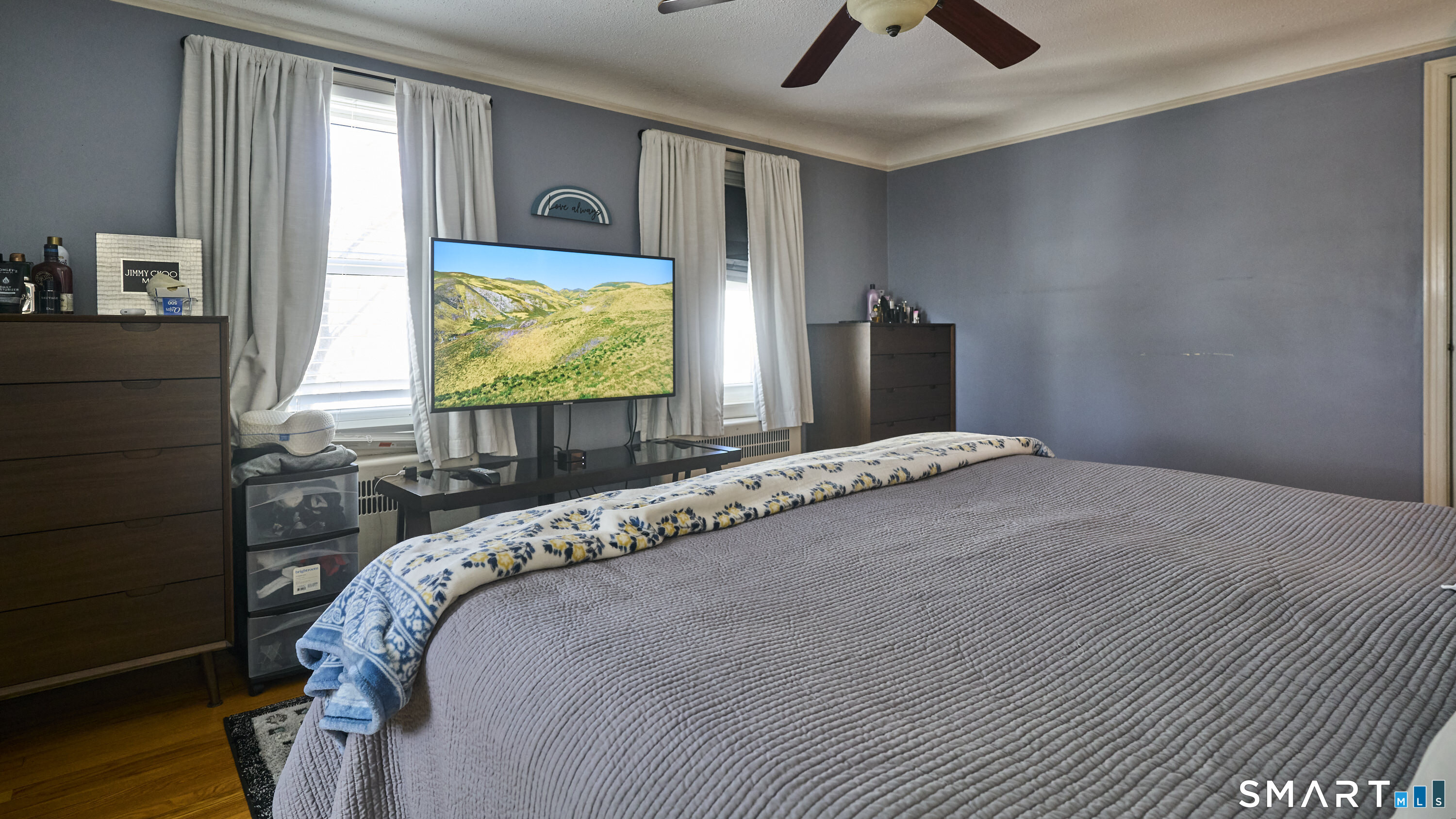 342 South Main Street West Hartford, CT 06107 - Photo 22 of 36 a bedroom with a bed and a flat screen tv