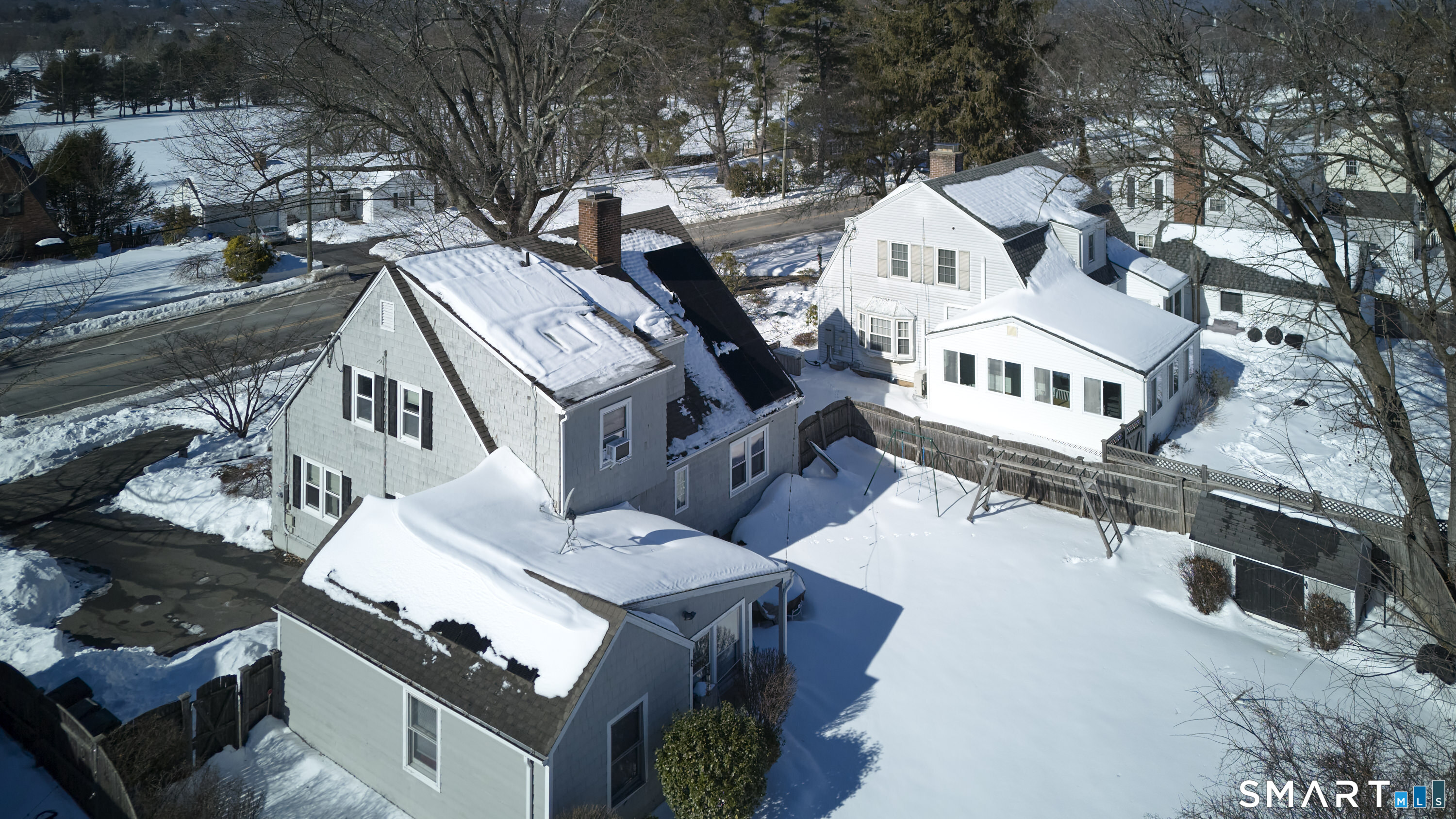 342 South Main Street West Hartford, CT 06107 - Photo 3 of 36 a view of a house with a yard covered with snow in the background