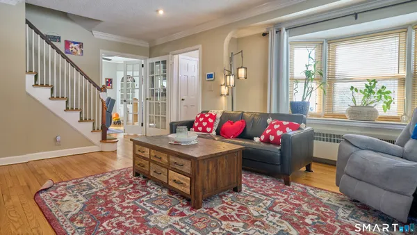 a view of a livingroom with furniture and a fireplace