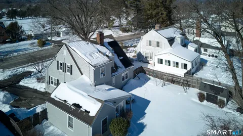 a view of a livingroom with furniture and a fireplace