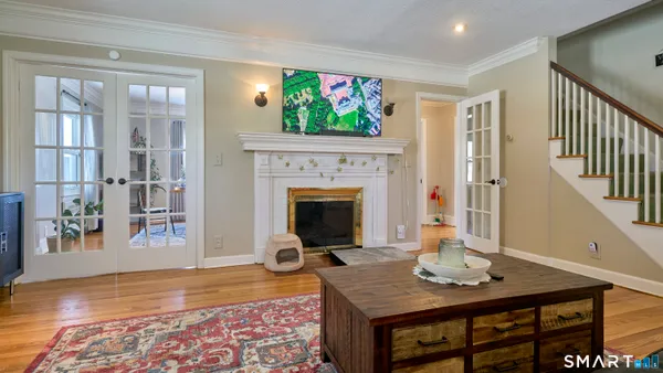 a living room with a fireplace and a window