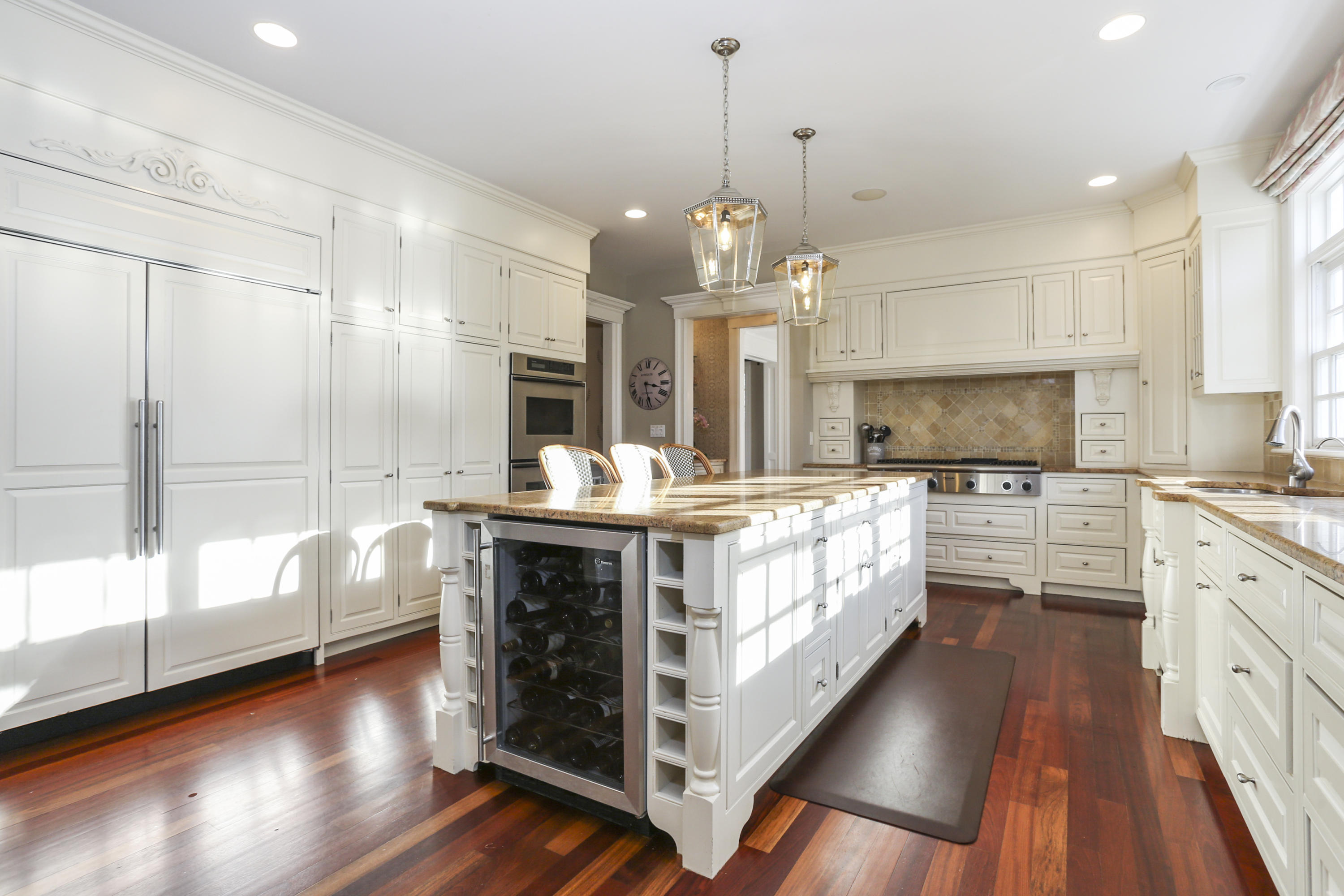 364 Smith Ridge Road New Canaan, CT 06840 - Photo 12 of 39 a kitchen with kitchen island granite countertop a stove oven and a white cabinets