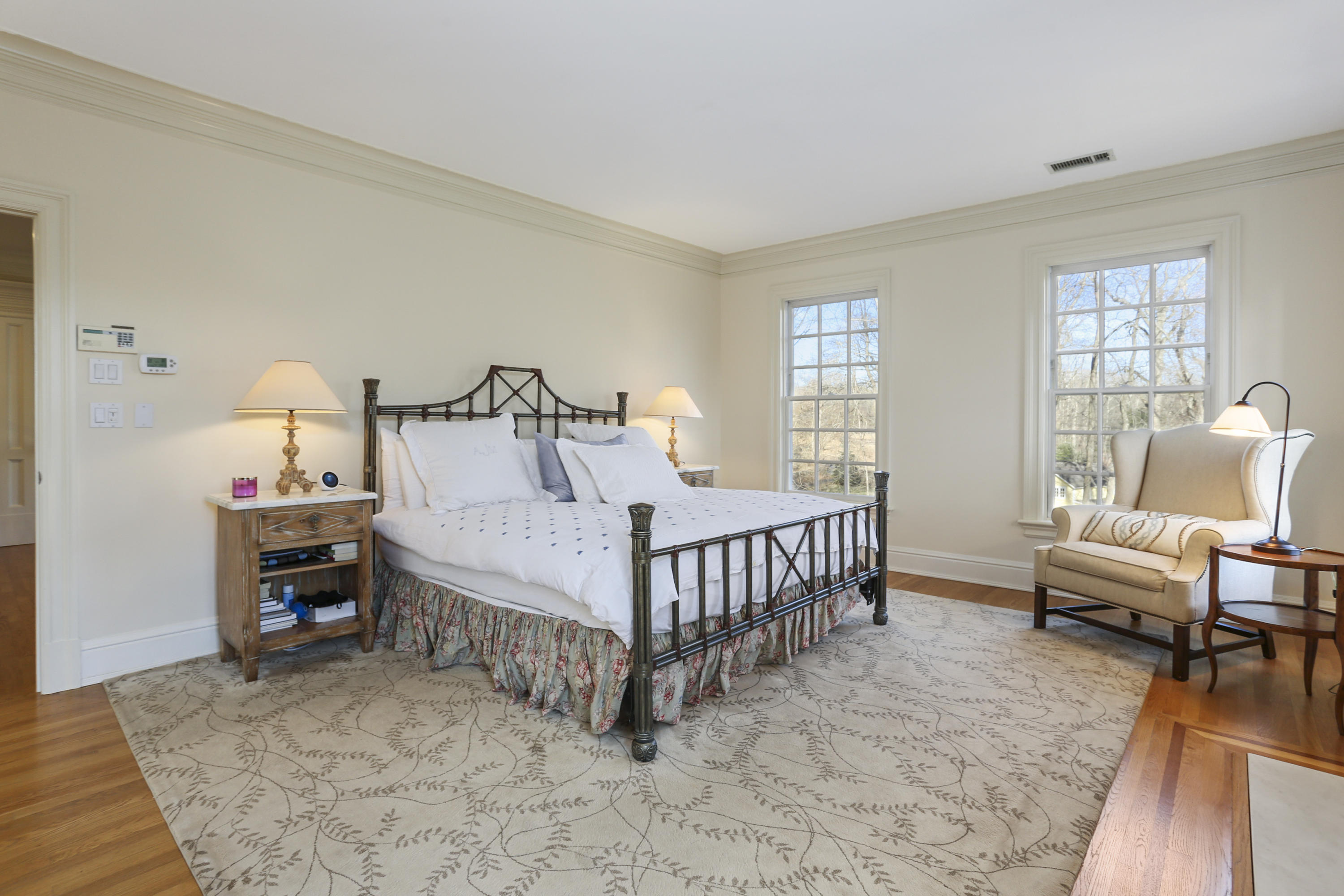 364 Smith Ridge Road New Canaan, CT 06840 - Photo 23 of 39 a bedroom with a bed and a couch