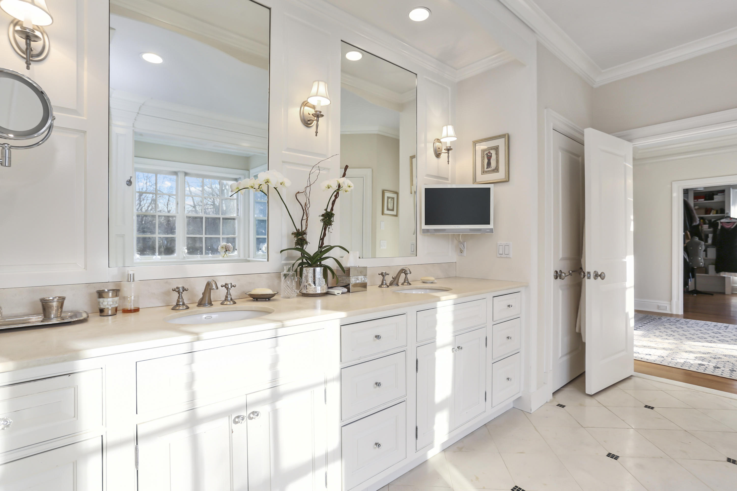 364 Smith Ridge Road New Canaan, CT 06840 - Photo 26 of 39 a bathroom with a double vanity sink mirror and next to a window