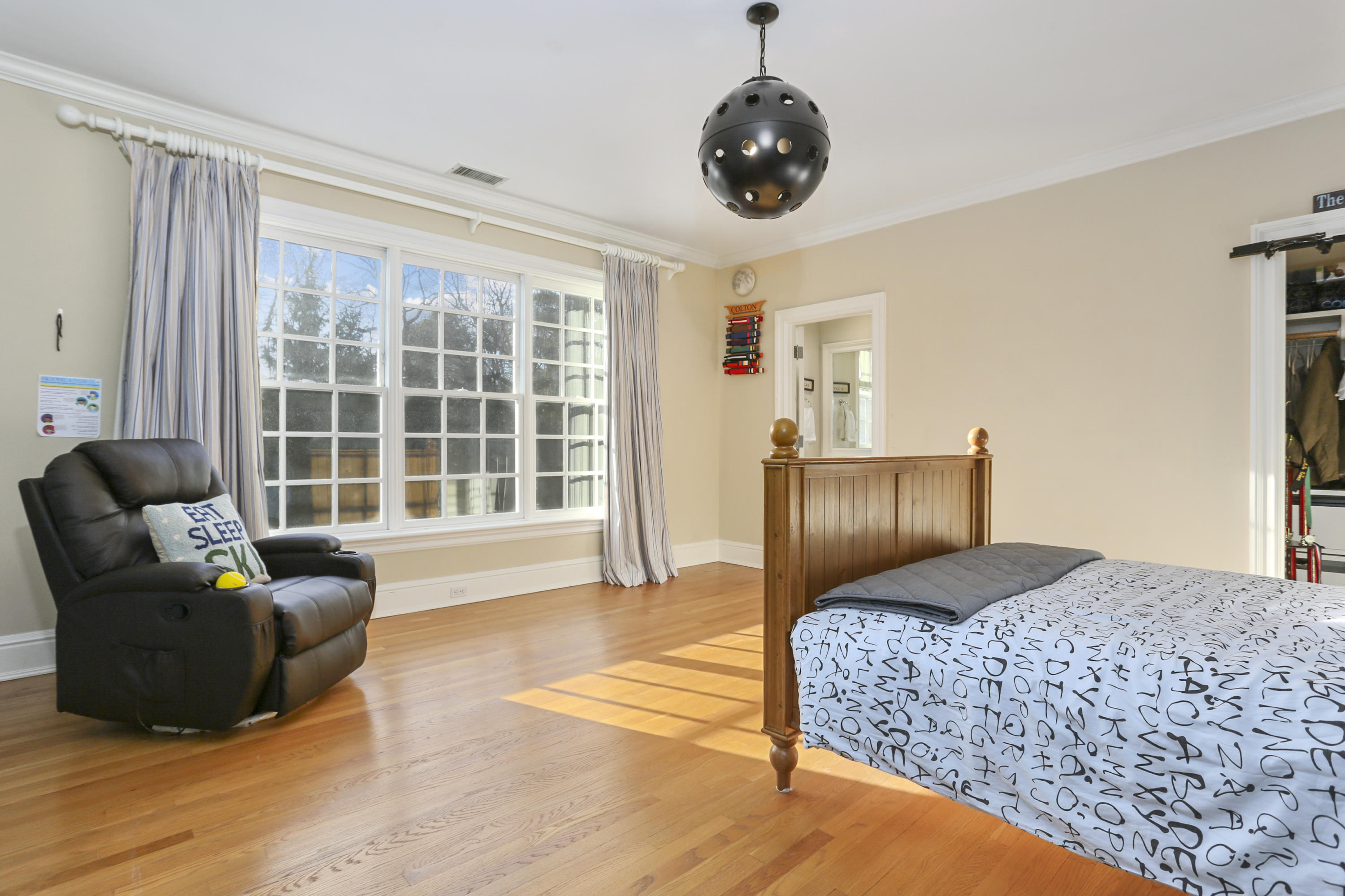 364 Smith Ridge Road New Canaan, CT 06840 - Photo 27 of 39 a bedroom with a bed and glass window