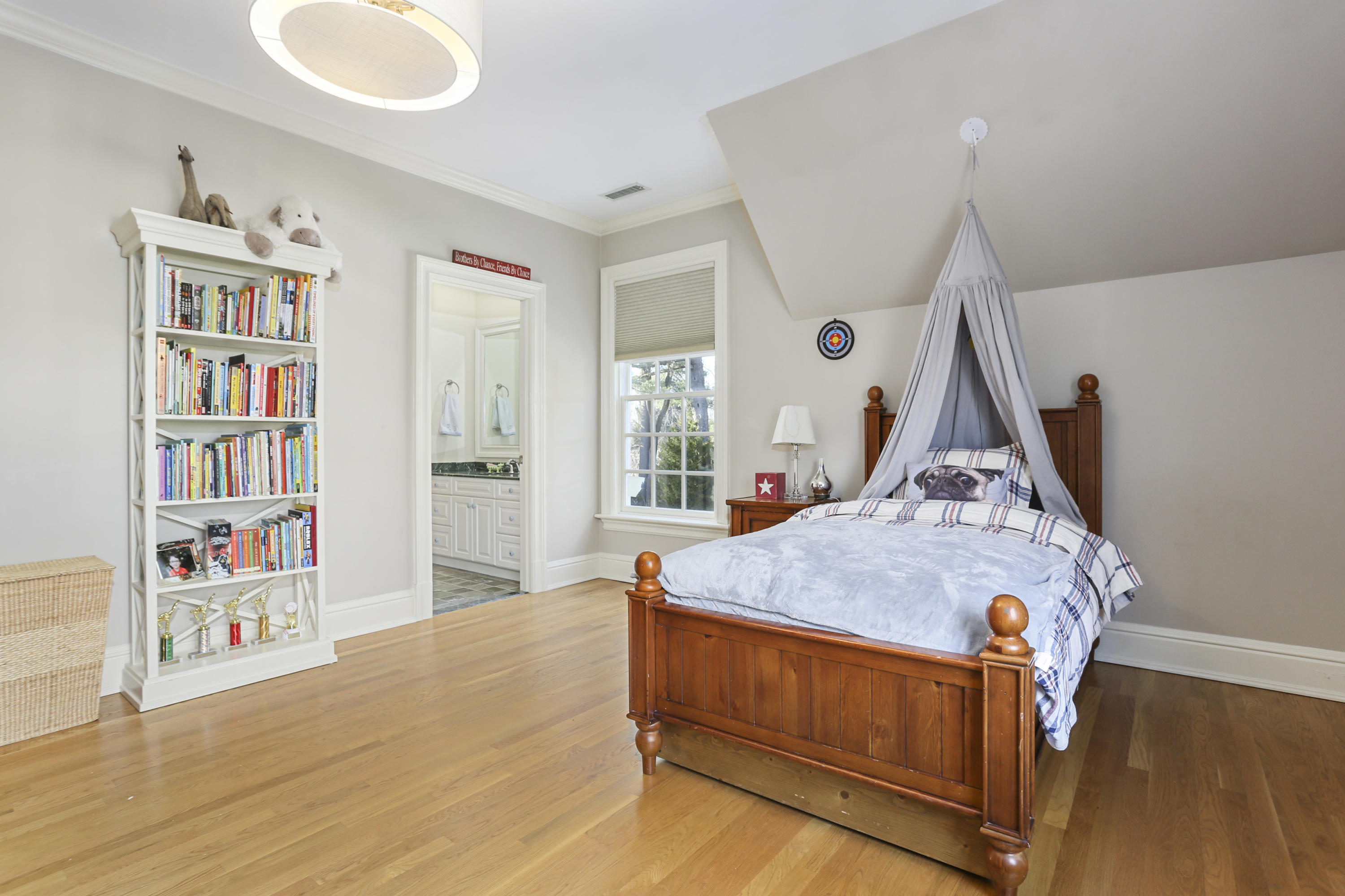 364 Smith Ridge Road New Canaan, CT 06840 - Photo 28 of 39 a living room with furniture and a book shelf