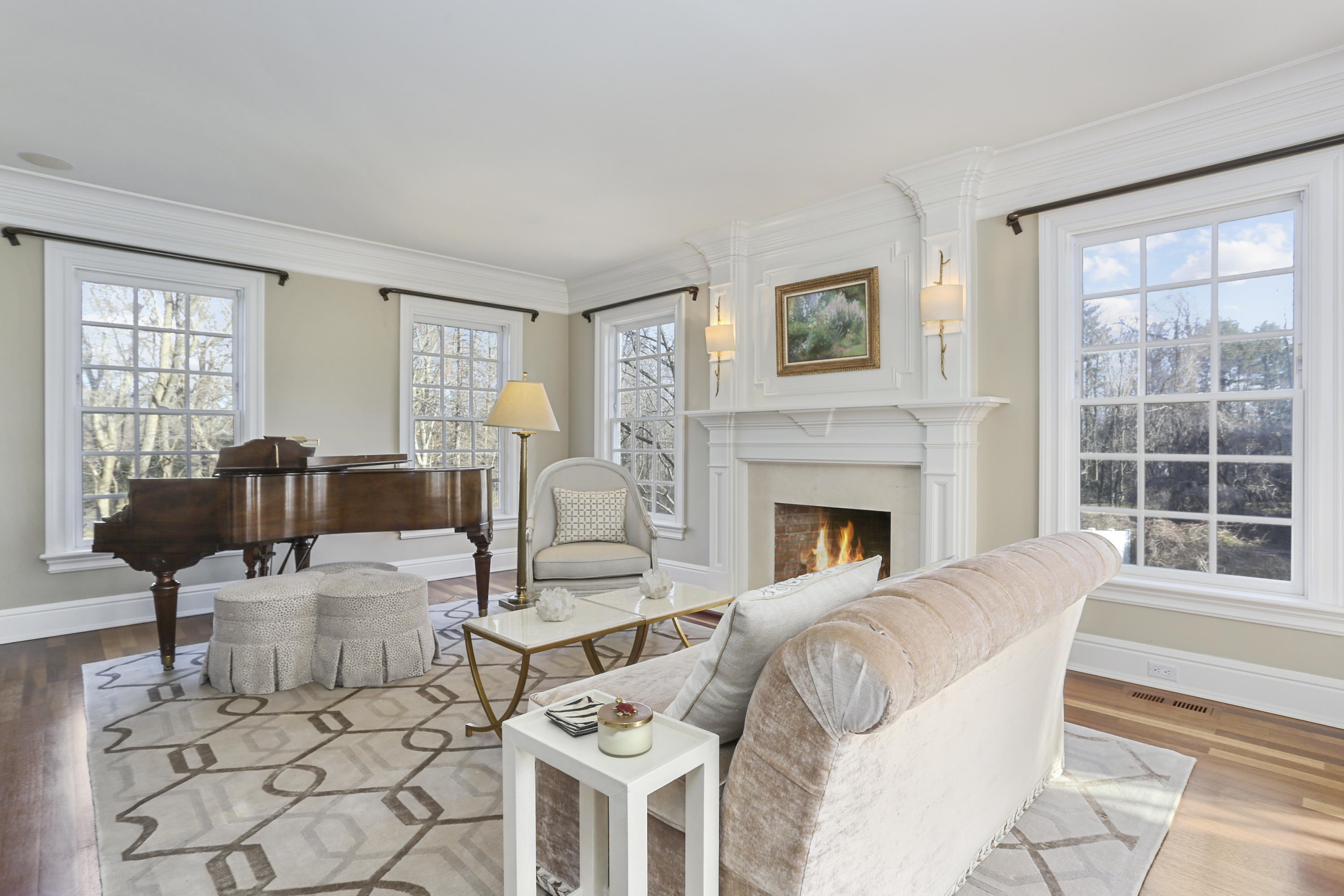 364 Smith Ridge Road New Canaan, CT 06840 - Photo 4 of 39 a living room with furniture and a fireplace