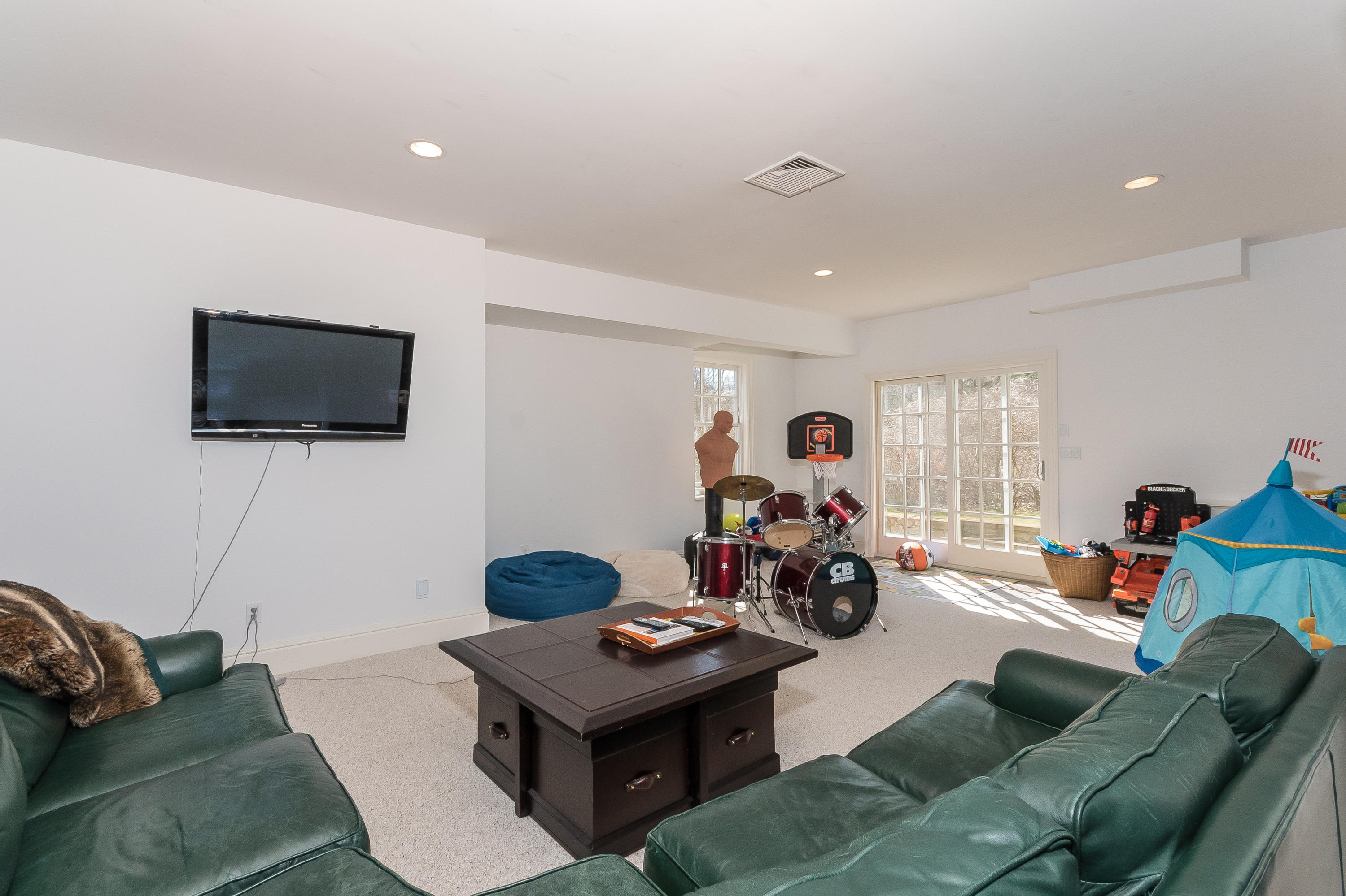 364 Smith Ridge Road New Canaan, CT 06840 - Photo 33 of 39 a view of a livingroom with furniture and a flat screen tv