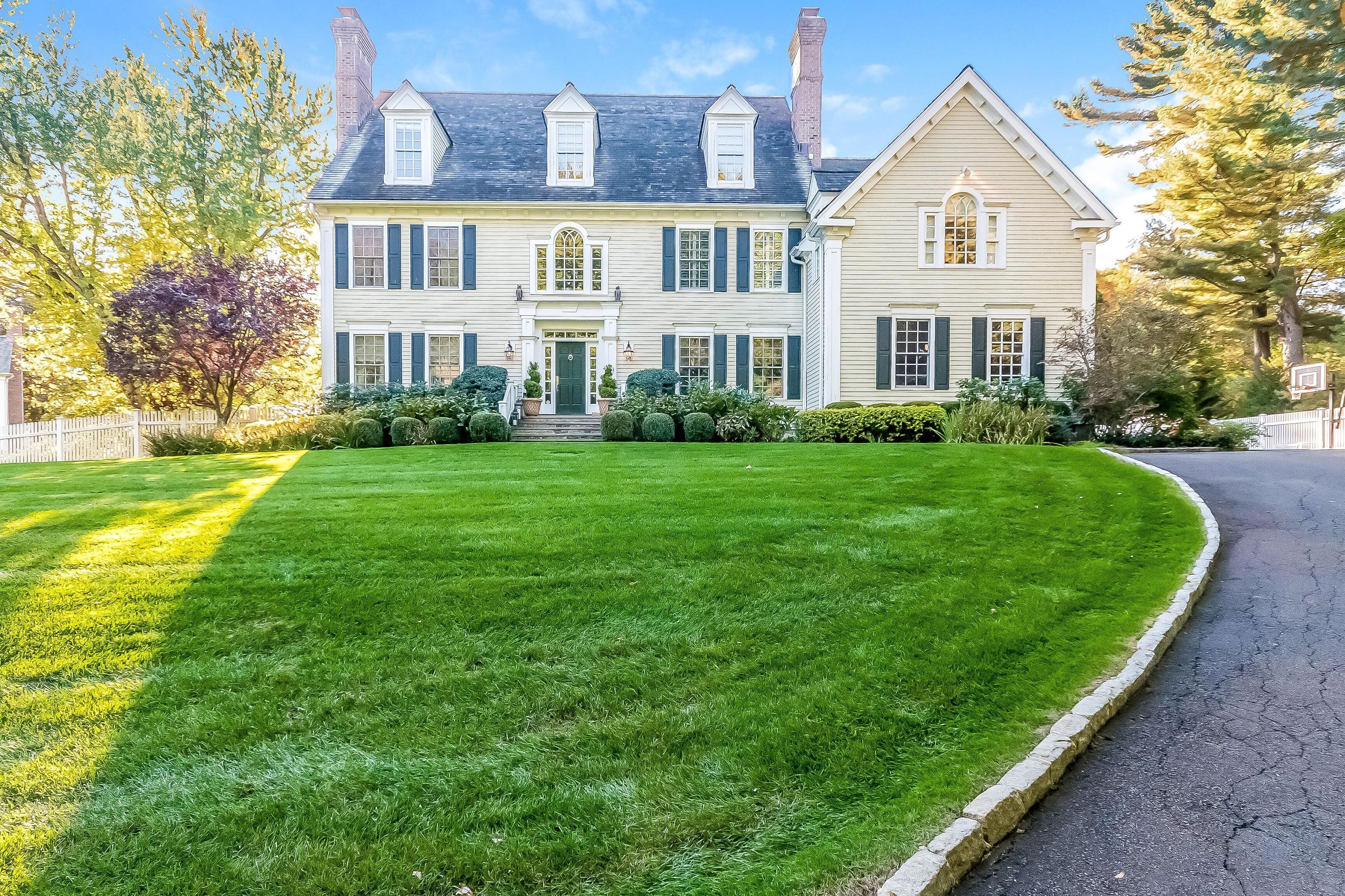 364 Smith Ridge Road New Canaan, CT 06840 - Photo 34 of 39 a front view of a house with a yard