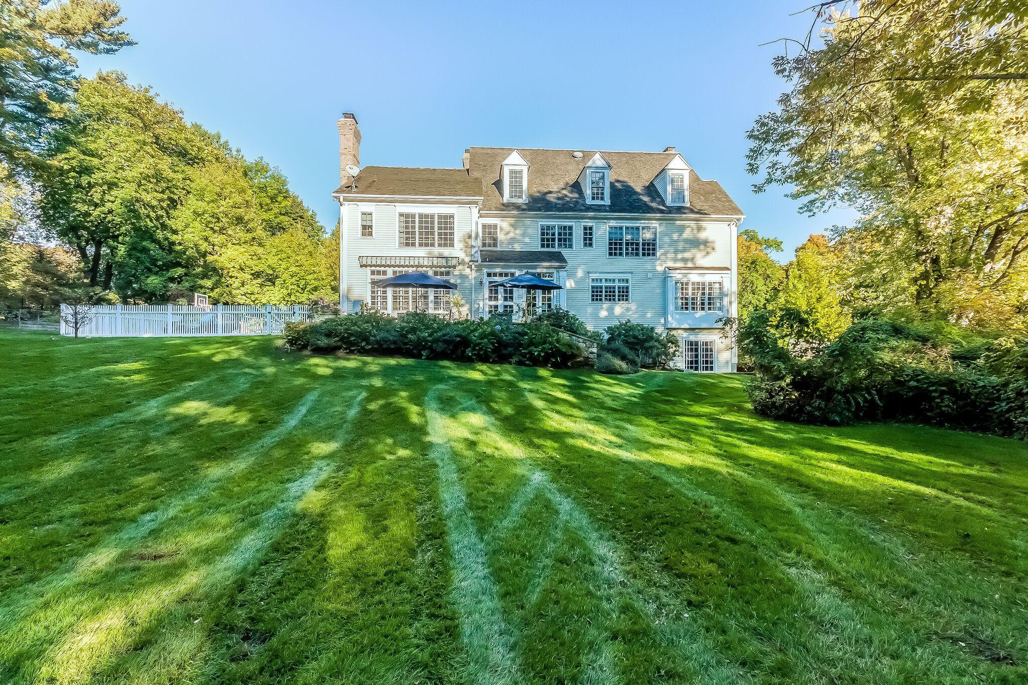 364 Smith Ridge Road New Canaan, CT 06840 - Photo 37 of 39 a front view of a house with a yard