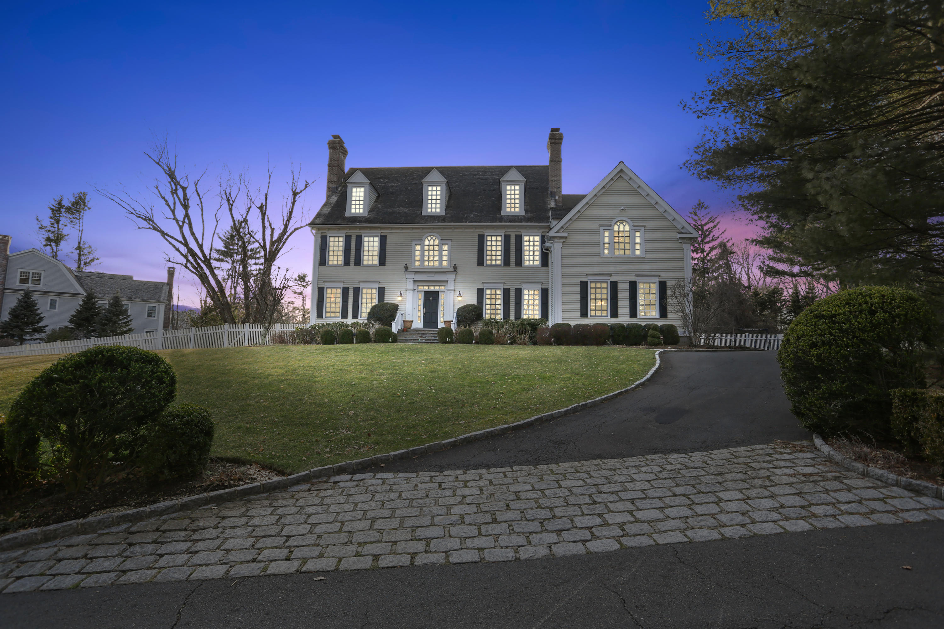 364 Smith Ridge Road New Canaan, CT 06840 - Photo 39 of 39 a front view of a house with a yard