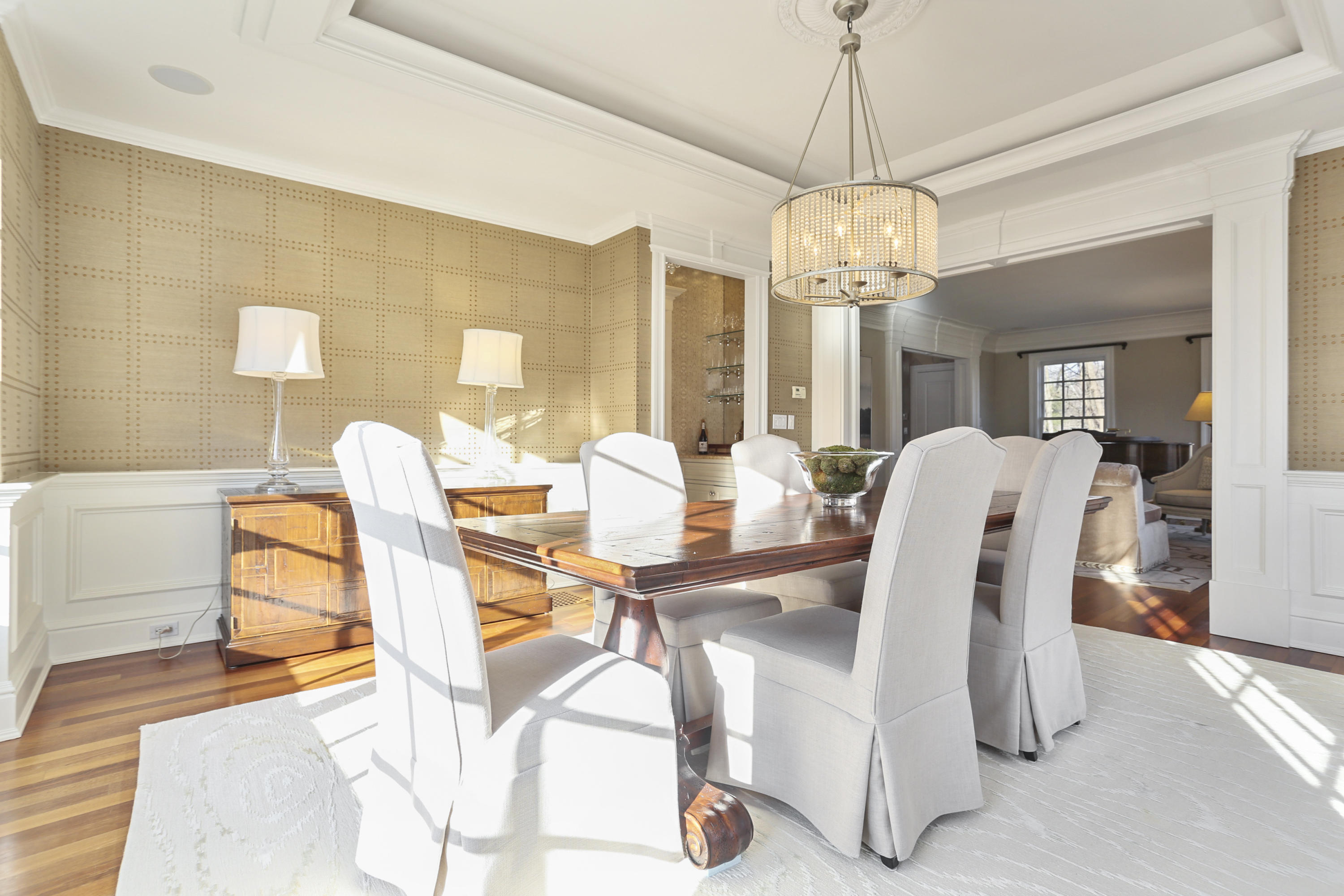 364 Smith Ridge Road New Canaan, CT 06840 - Photo 6 of 39 a view of a dining room with furniture and chandelier
