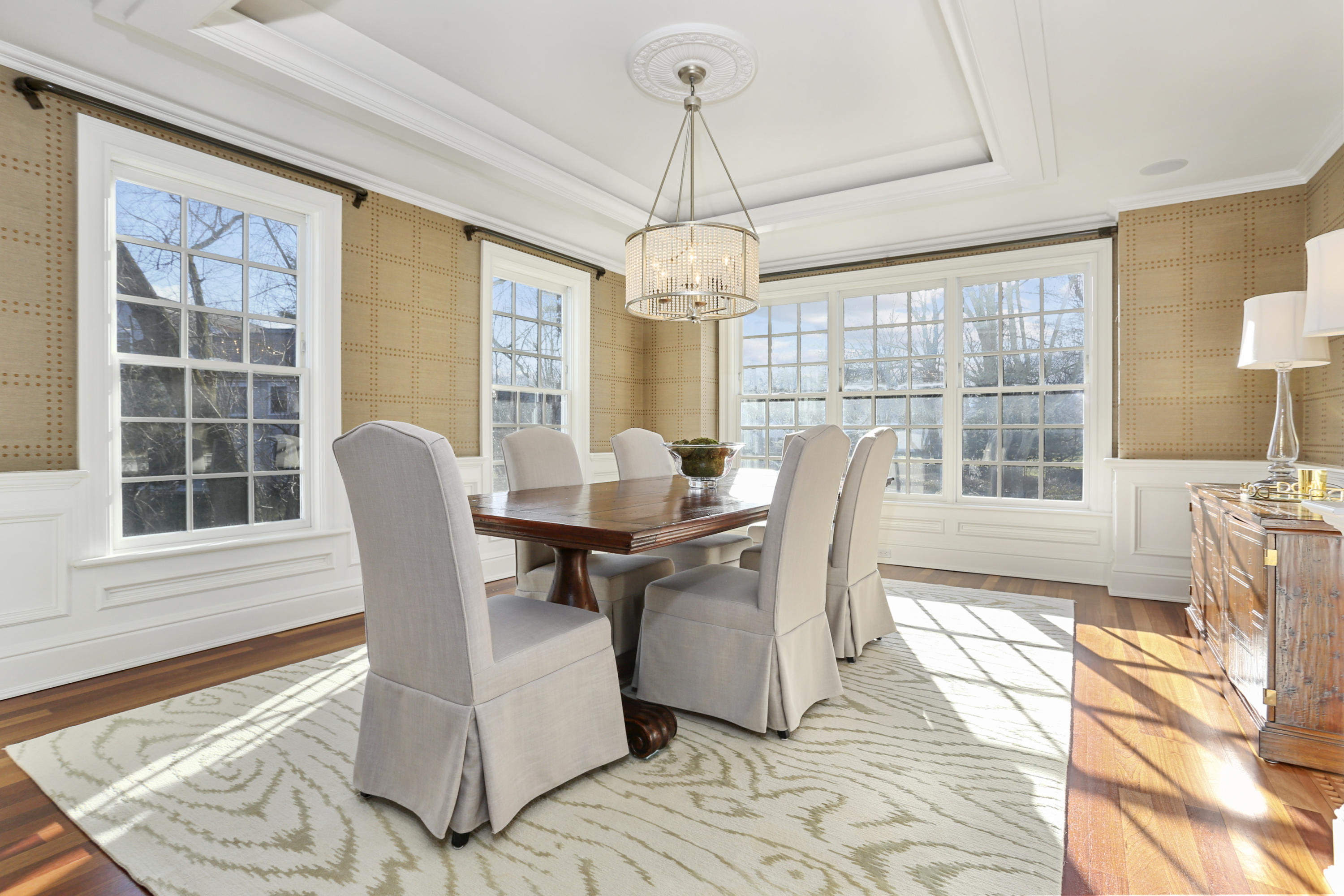 364 Smith Ridge Road New Canaan, CT 06840 - Photo 7 of 39 a dining room with furniture a chandelier and wooden floor