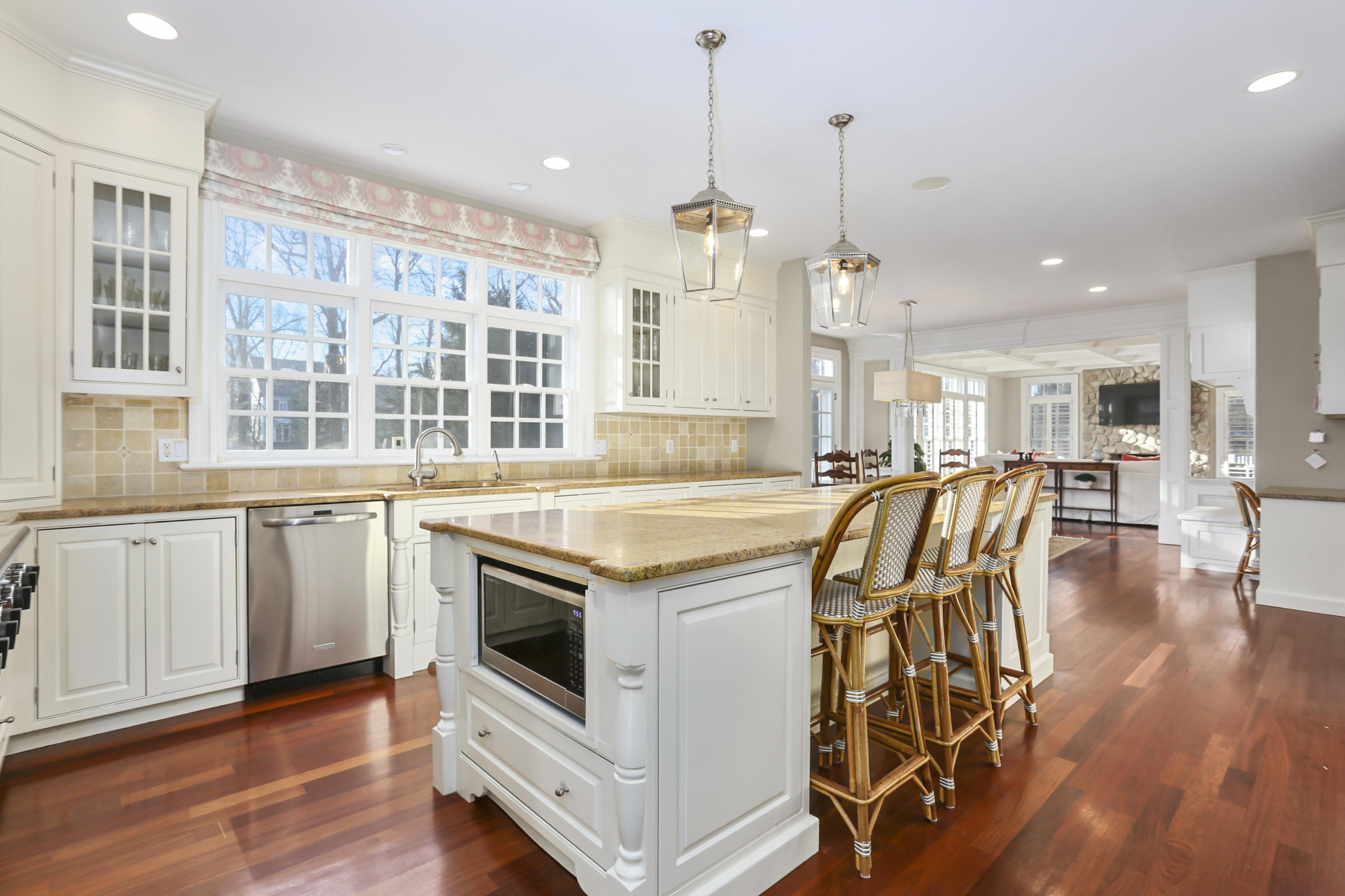 364 Smith Ridge Road New Canaan, CT 06840 - Photo 10 of 39 a kitchen with stainless steel appliances granite countertop a stove and a wooden floors