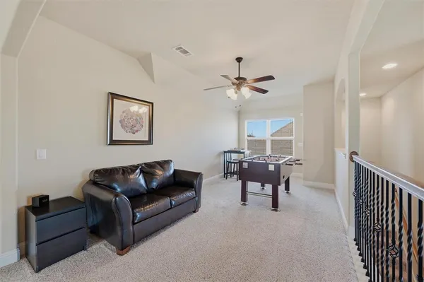 a living room with furniture and a gate