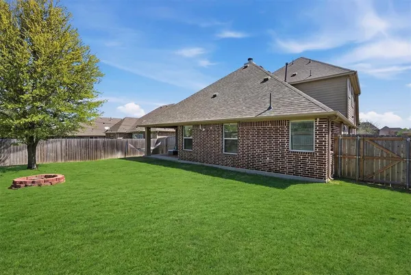 an aerial view of a house with a big yard