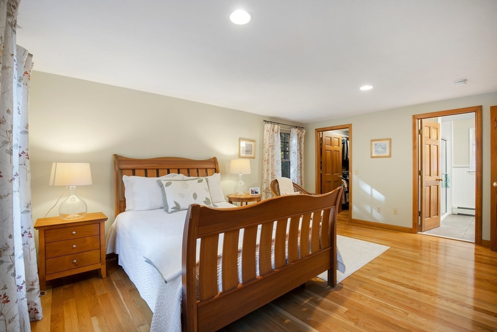 46 Oak Street Barnstable, MA 02635 - Photo 14 of 40 a bedroom with a bed and wooden floor