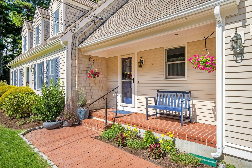 46 Oak Street Barnstable, MA 02635 - Photo 2 of 40 a front view of a house with a chair