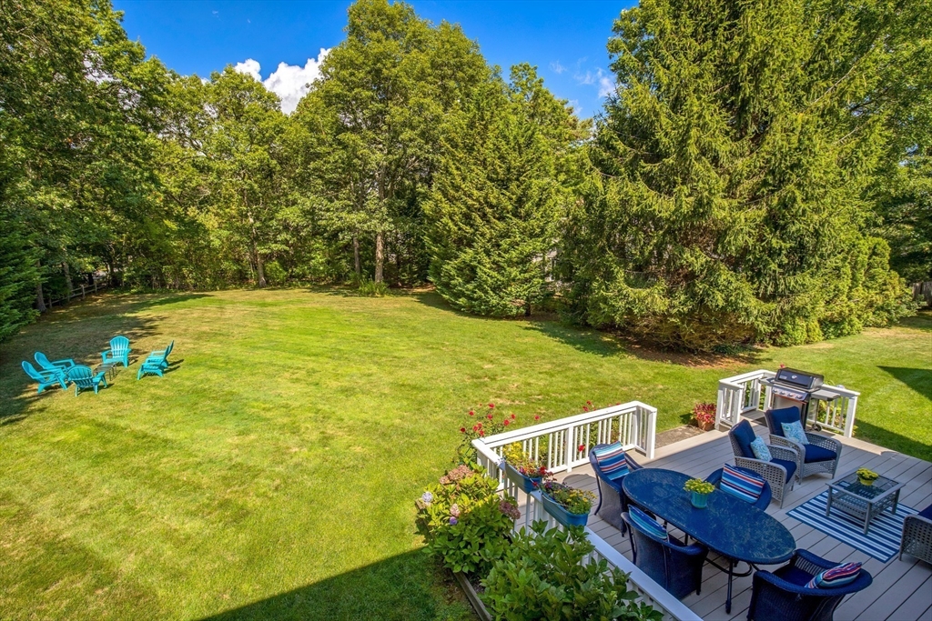 46 Oak Street Barnstable, MA 02635 - Photo 5 of 40 a view of a chairs and table on the plants and floor