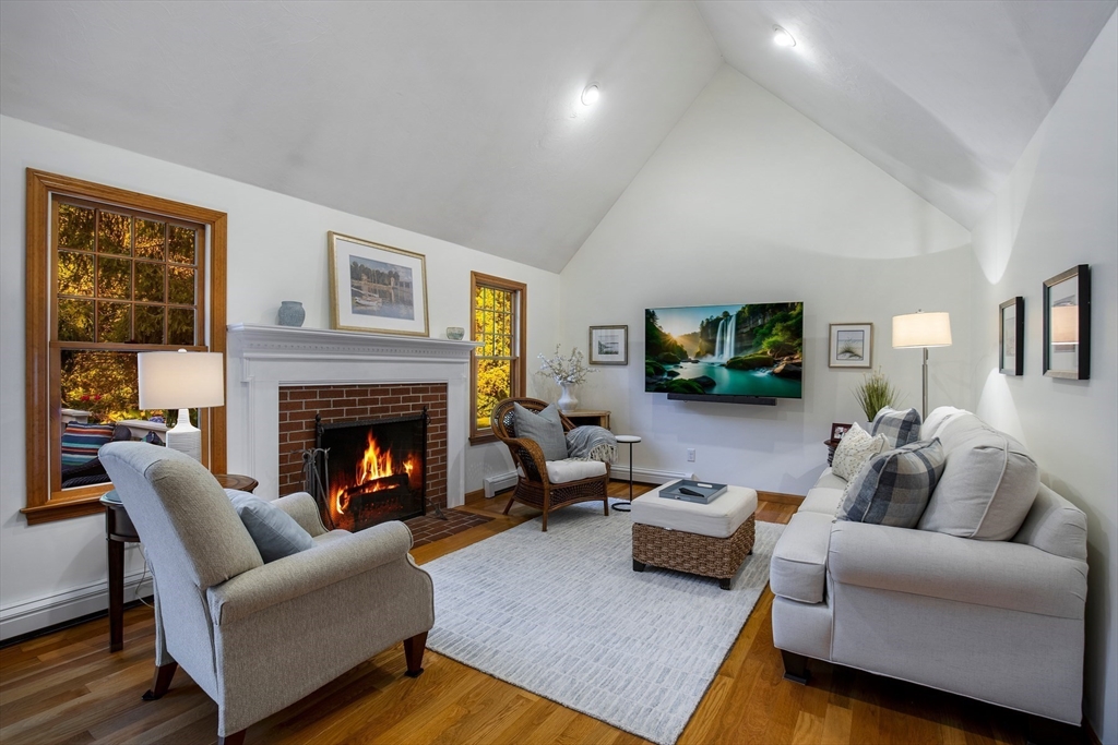 46 Oak Street Barnstable, MA 02635 - Photo 10 of 40 a living room with furniture and a fireplace