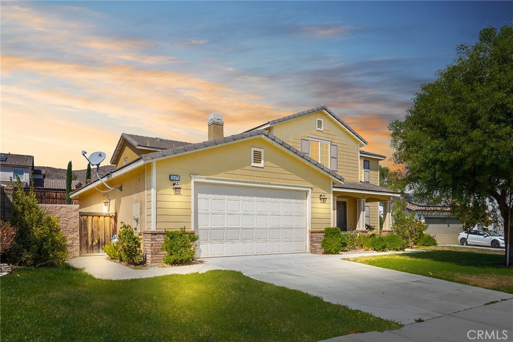 28475 Nautical Point Circle Menifee, CA 92585 - Photo 1 of 1 a front view of a house with a yard and garage