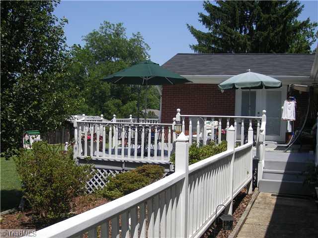 8020 Linville Road Oak Ridge, NC 27310 - Photo 3 of 10 Patio/Deck. Patio located off the living room and master bedroom