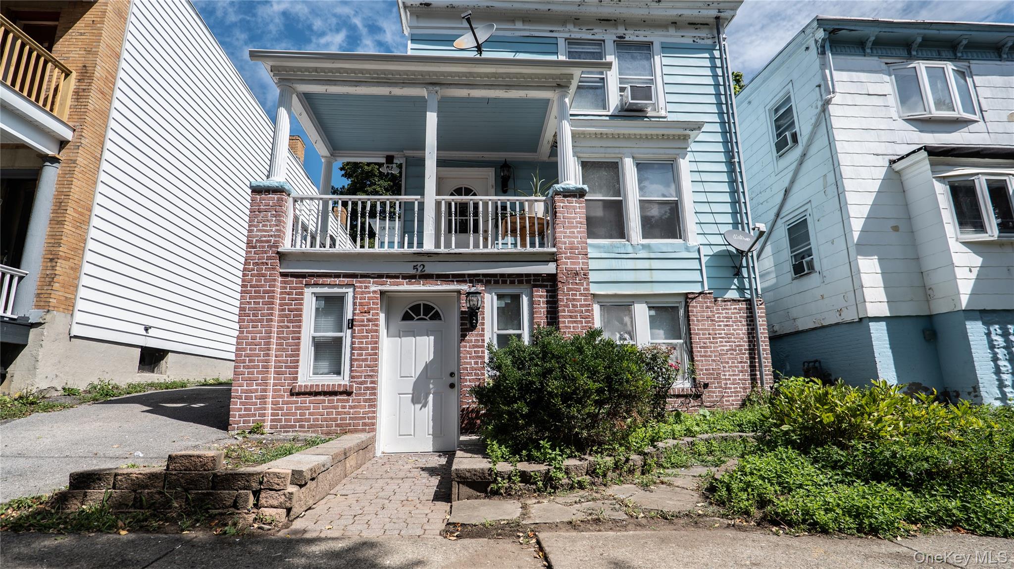 52 Beacon Street Newburgh, NY 12550 - Photo 2 of 12 Italianate home with a balcony and brick siding