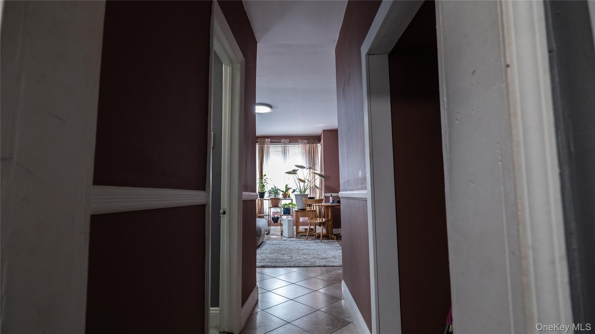 52 Beacon Street Newburgh, NY 12550 - Photo 8 of 12 Corridor with tile patterned flooring and baseboards